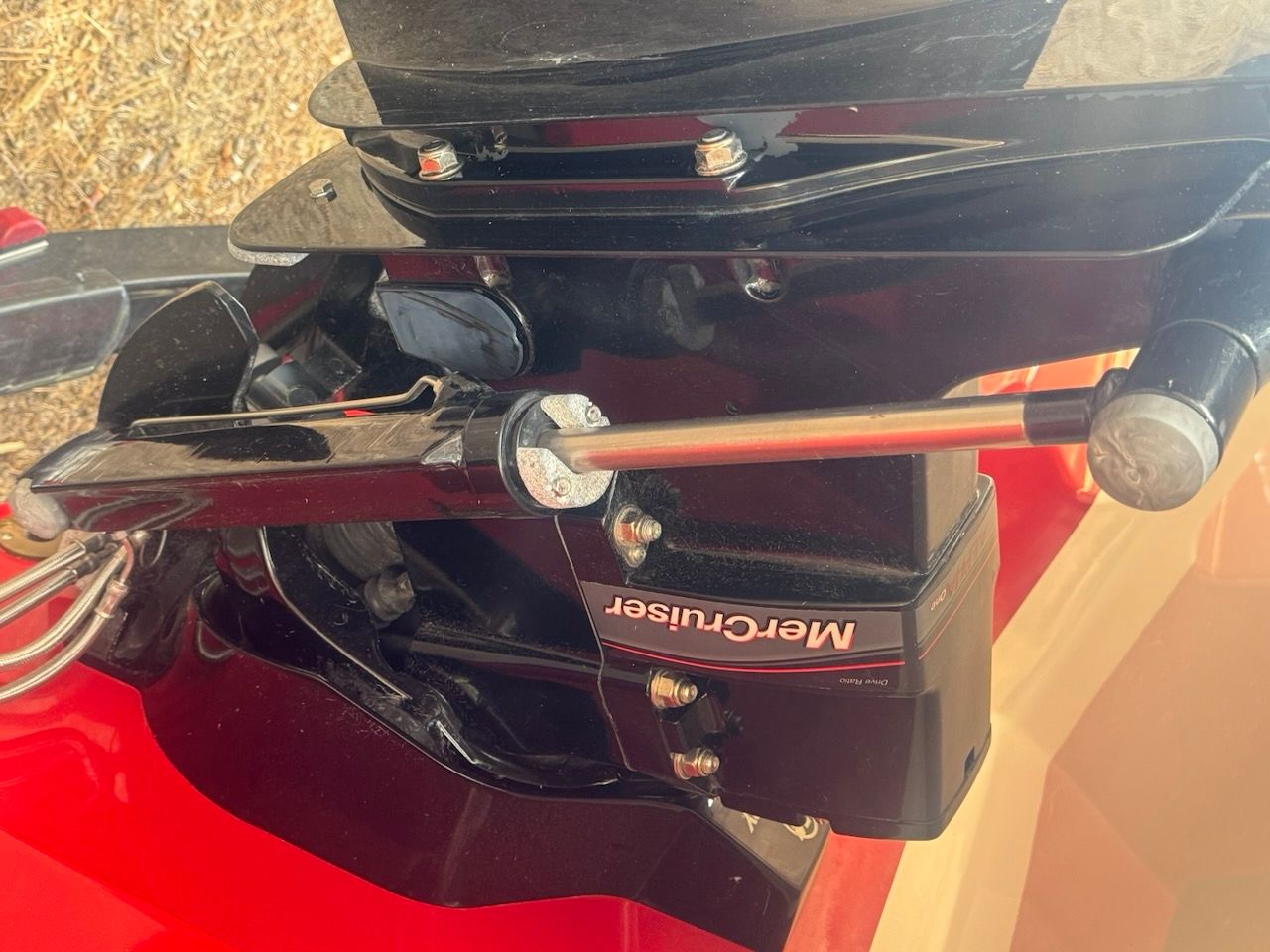 Close-up of a black outboard motor with "MerCruiser" branding.