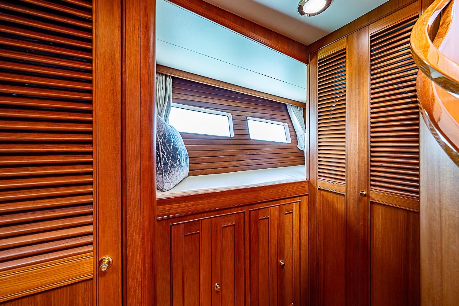Luxurious wooden interior of 2014 Marlow 80 Explorer yacht cabin.
