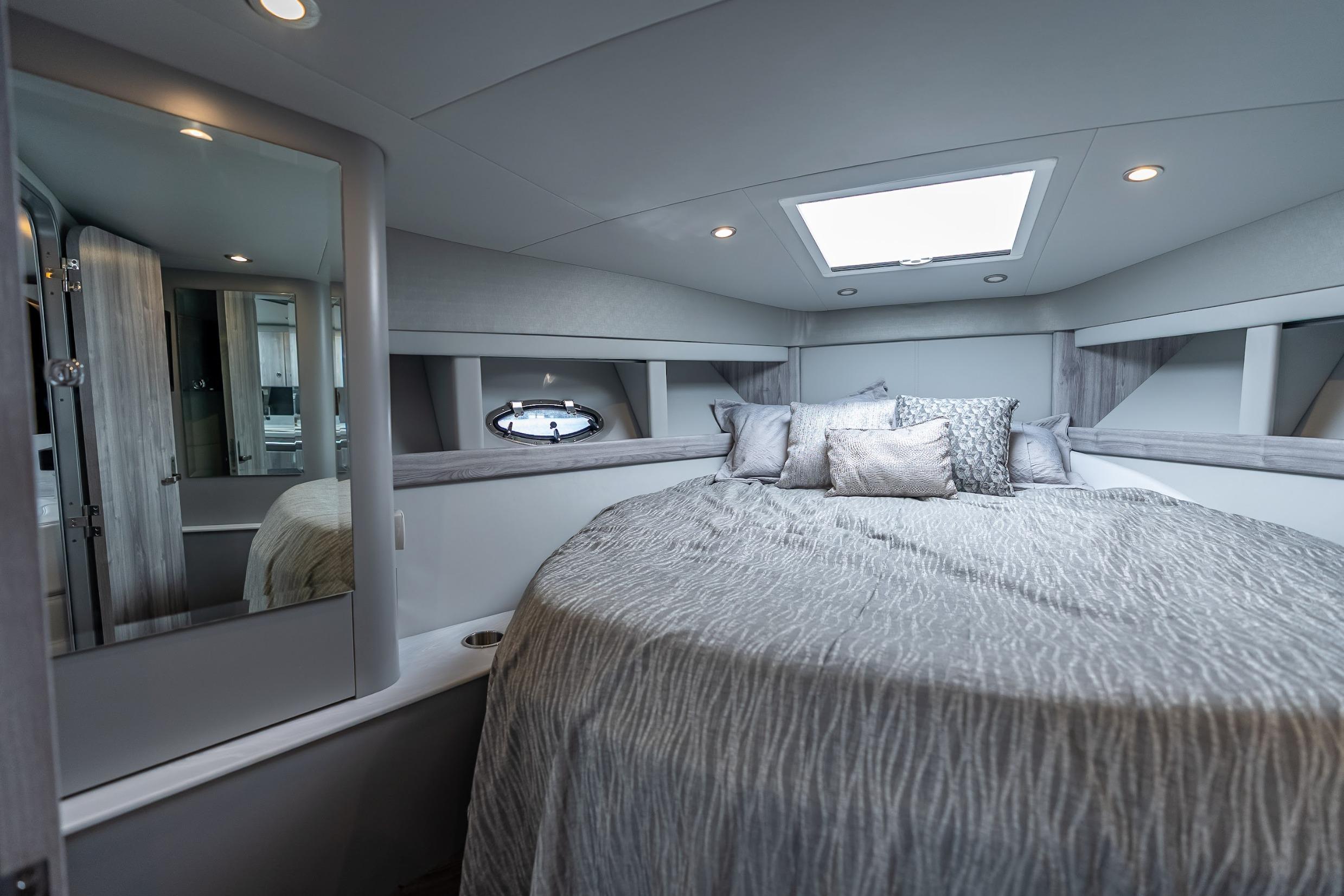 Luxurious interior of 2022 Formula 40 Performance Cruiser with elegant bedding and modern design.