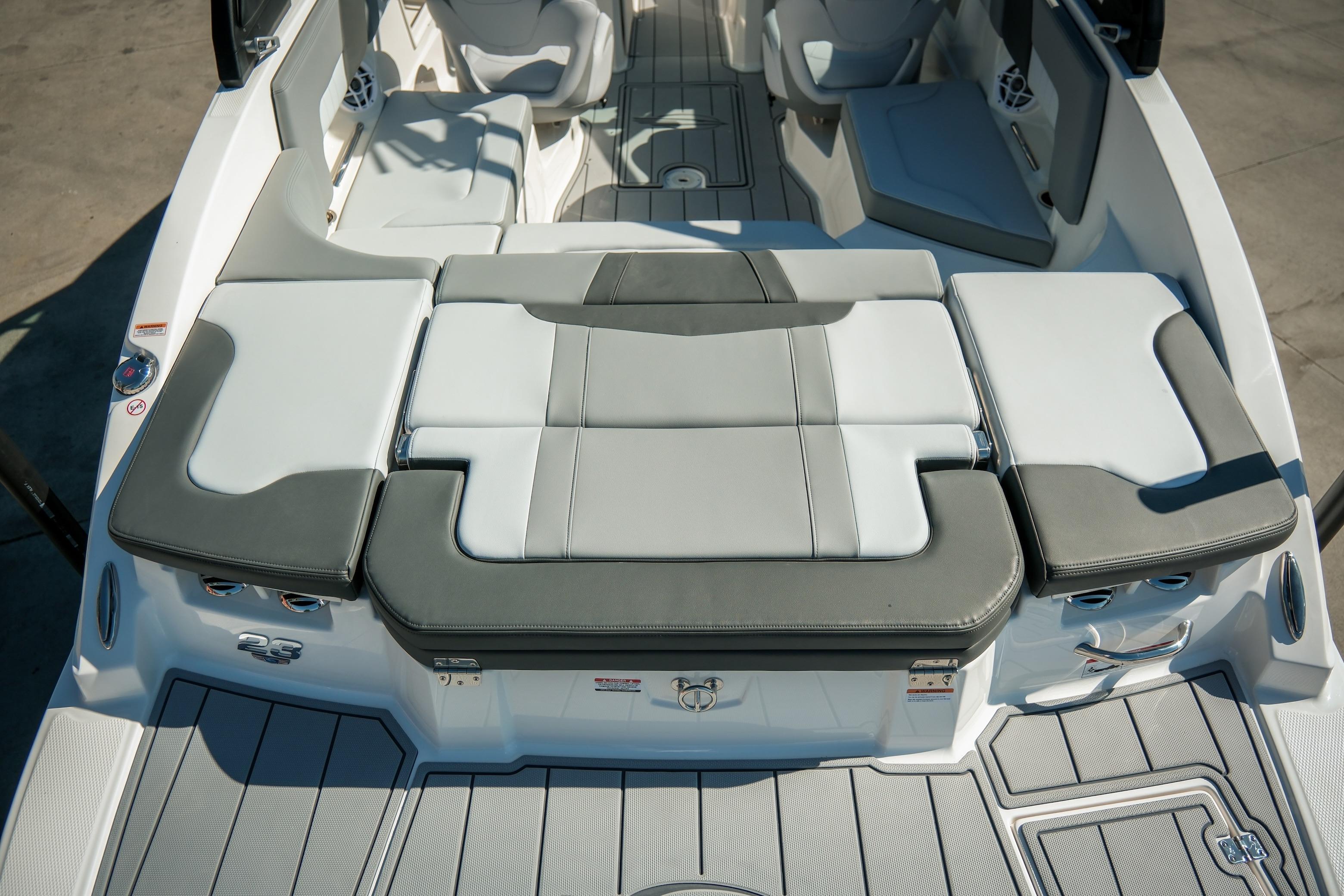 2026 Chaparral 23 SSi boat interior with gray and white cushioned seating.