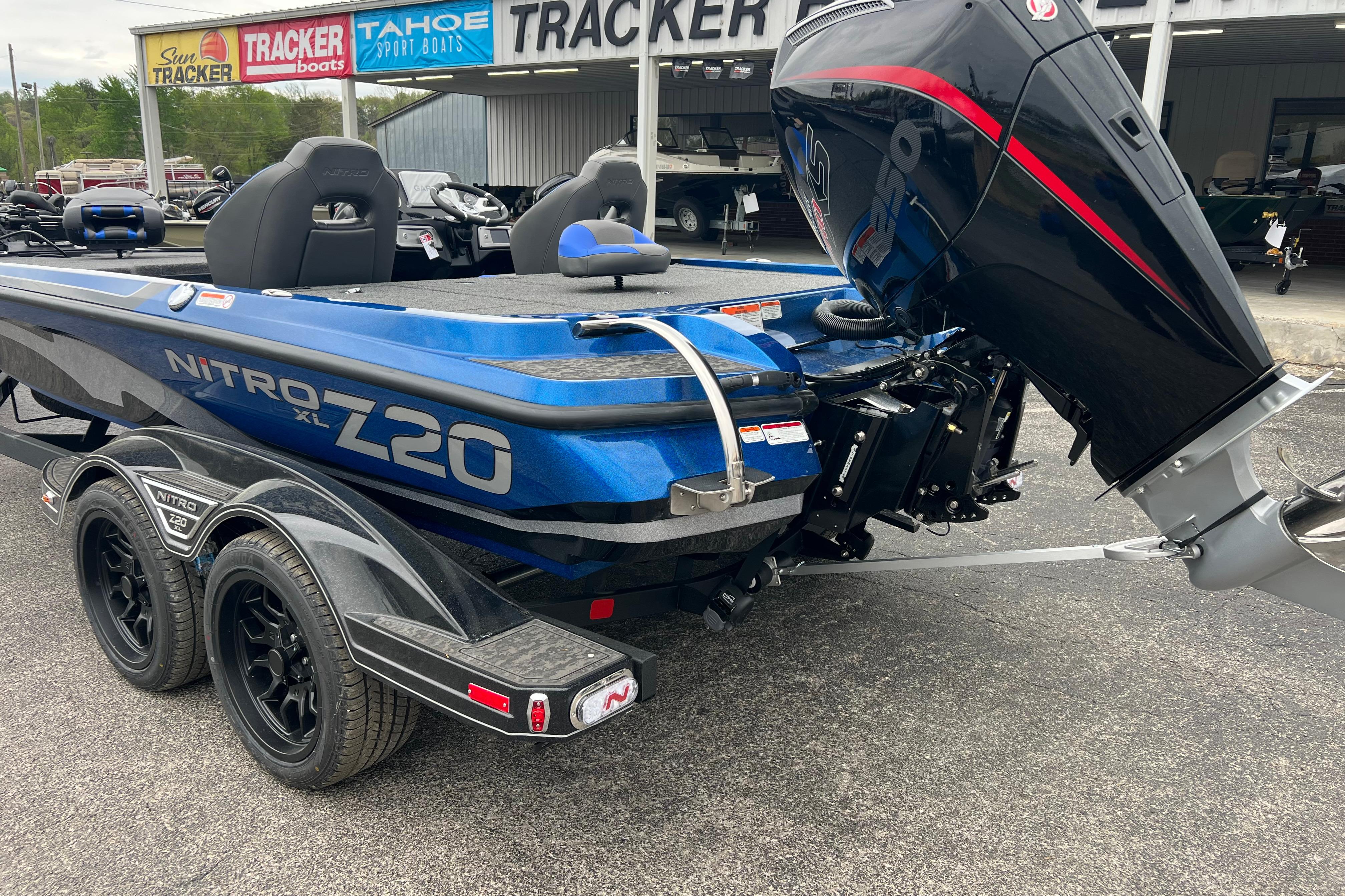 2026 Nitro Z20 XL Pro boat with powerful outboard motor in dealership lot.