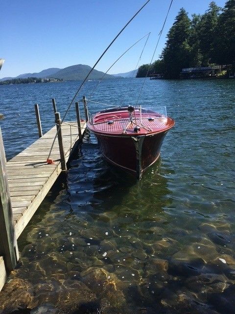 1950 Chris-Craft Sportsman boat docked in scenic lake setting.