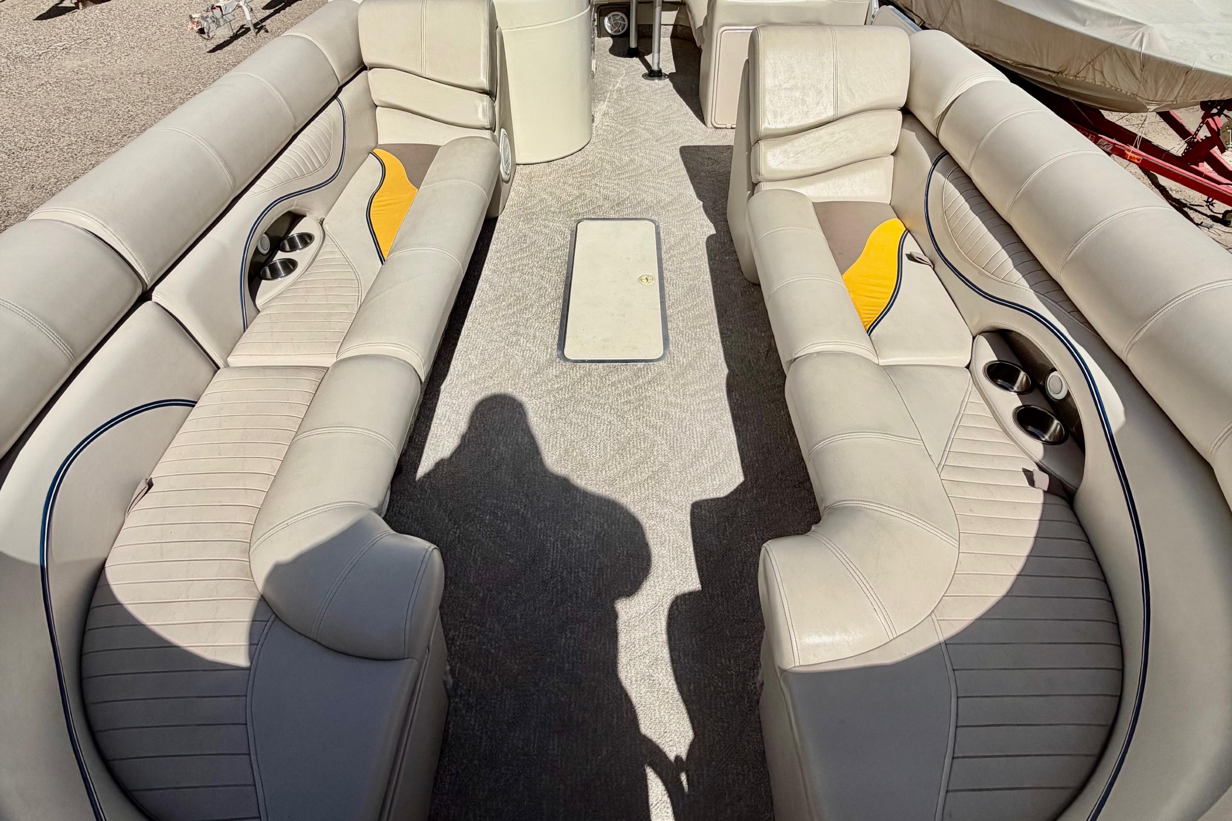 2006 South Bay 925CR boat interior with beige seating and cup holders.