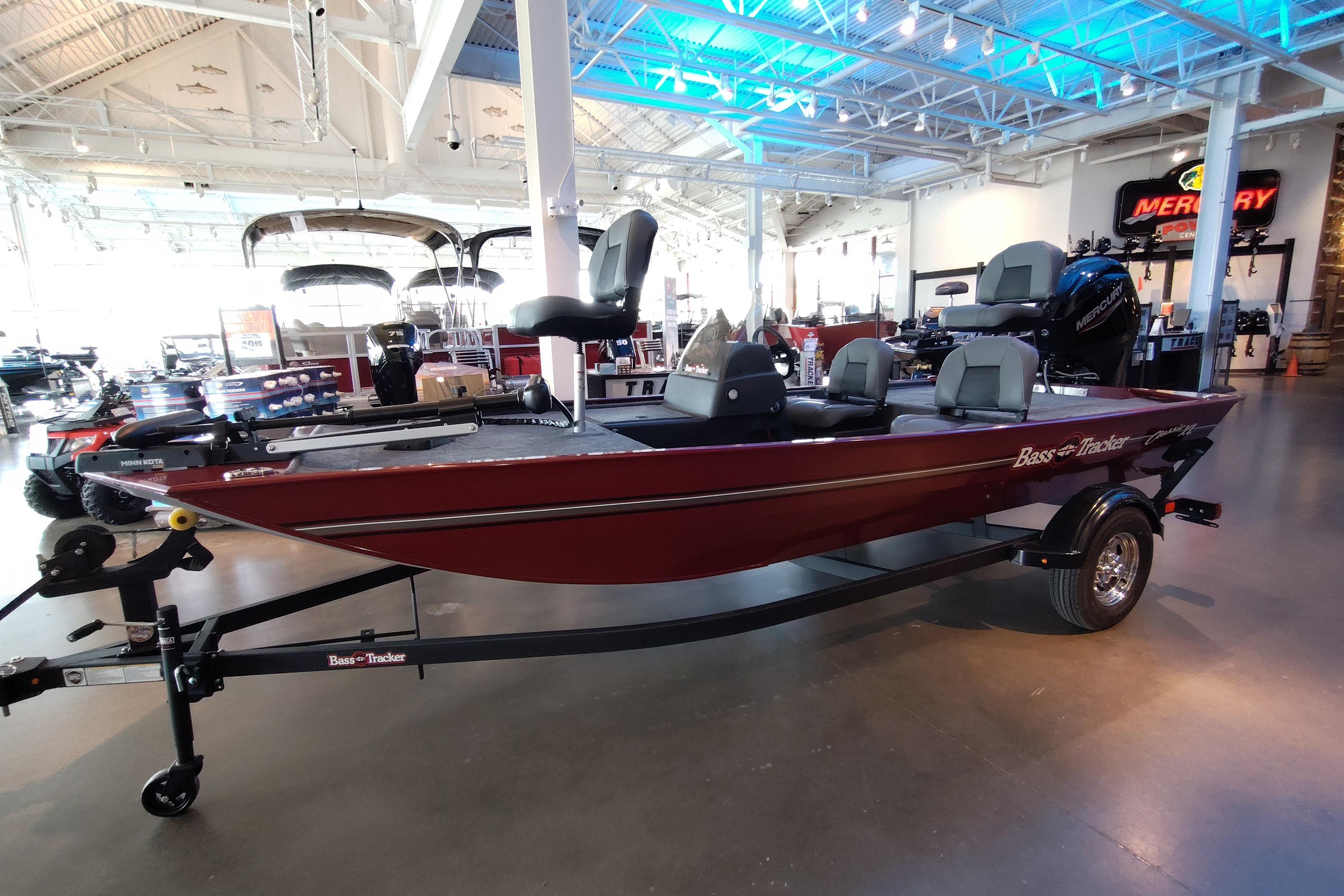 2026 Tracker Bass Tracker Classic XL boat displayed in a showroom with modern lighting.