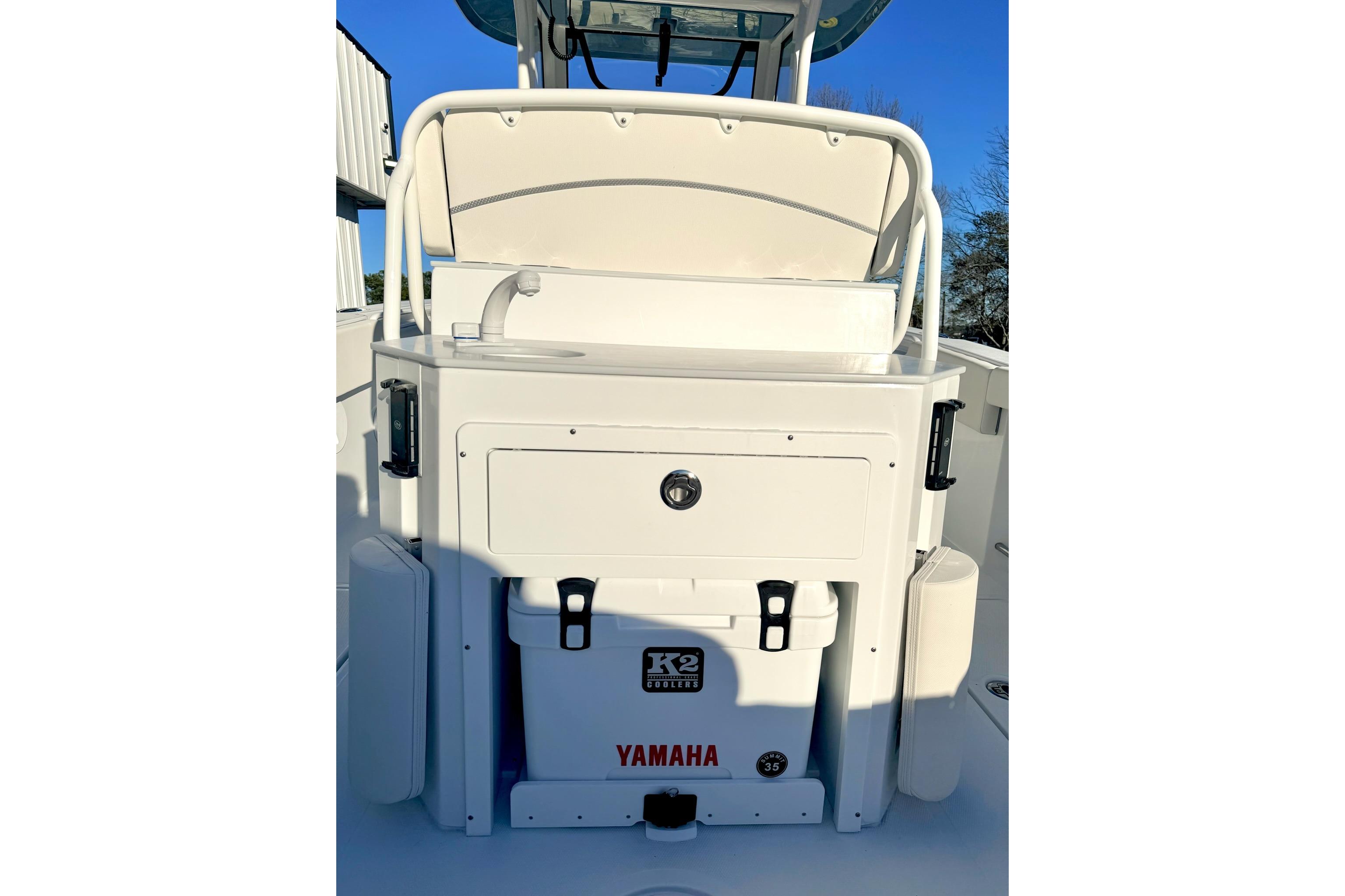 2026 Sea Hunt Ultra 275 Coffin Box boat interior with Yamaha cooler and storage.