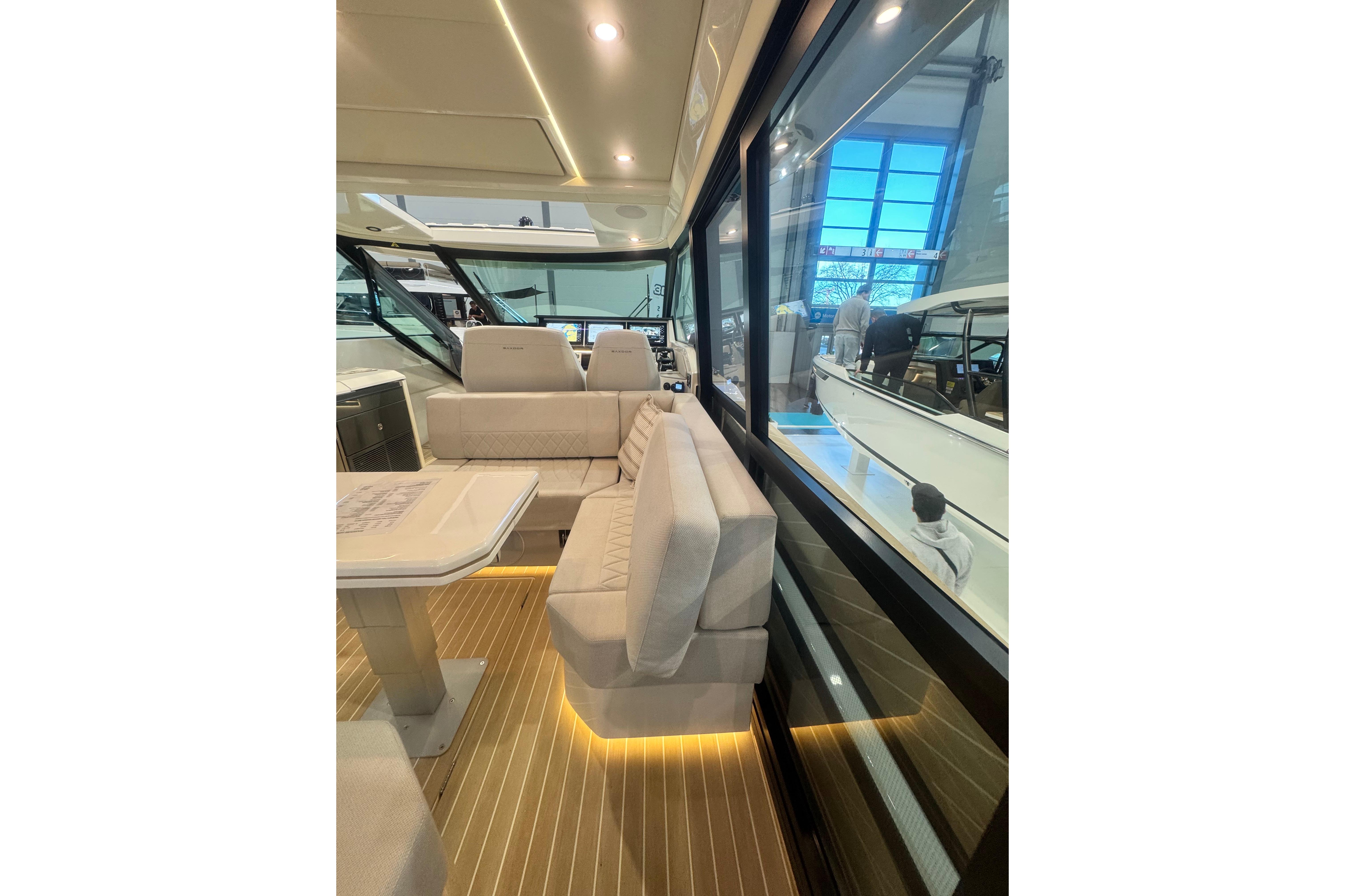 Luxurious interior of 2026 Saxdor 400 GTC yacht with elegant seating and modern design.