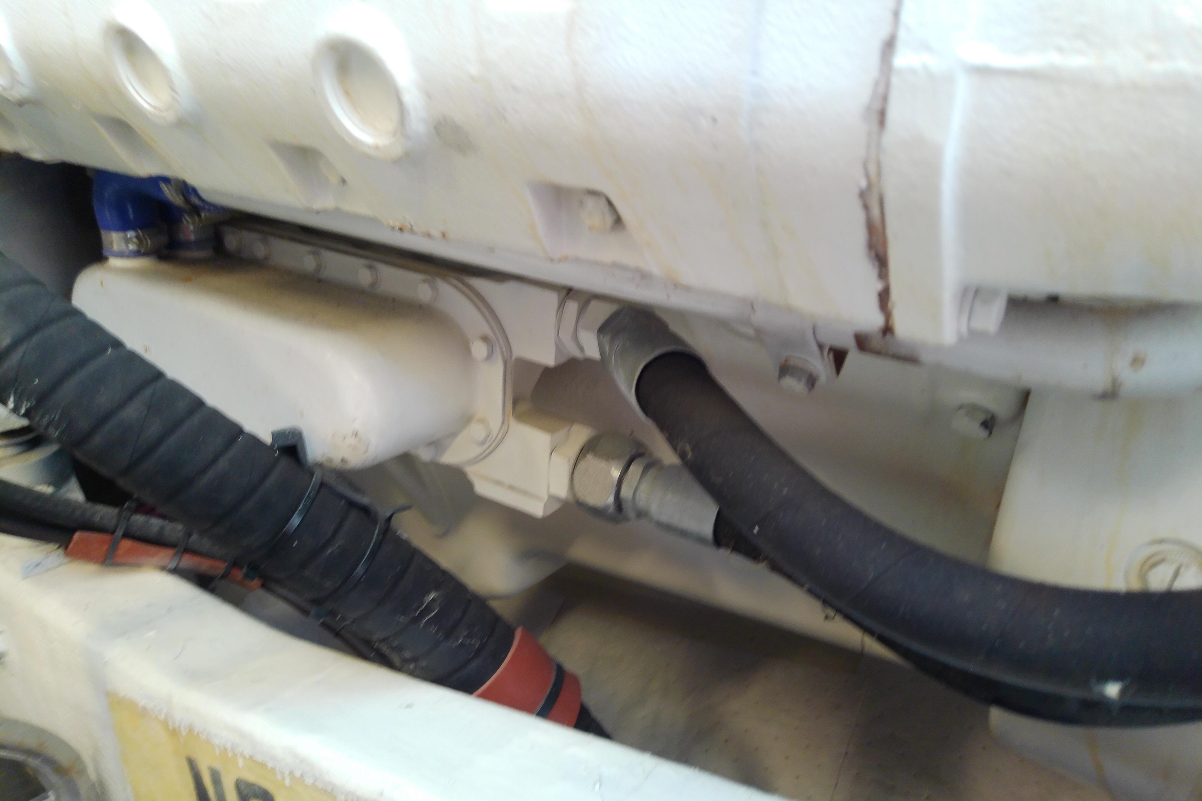 Engine compartment of a 2000 Tiara Yachts 4100 Open, showing hoses and components.