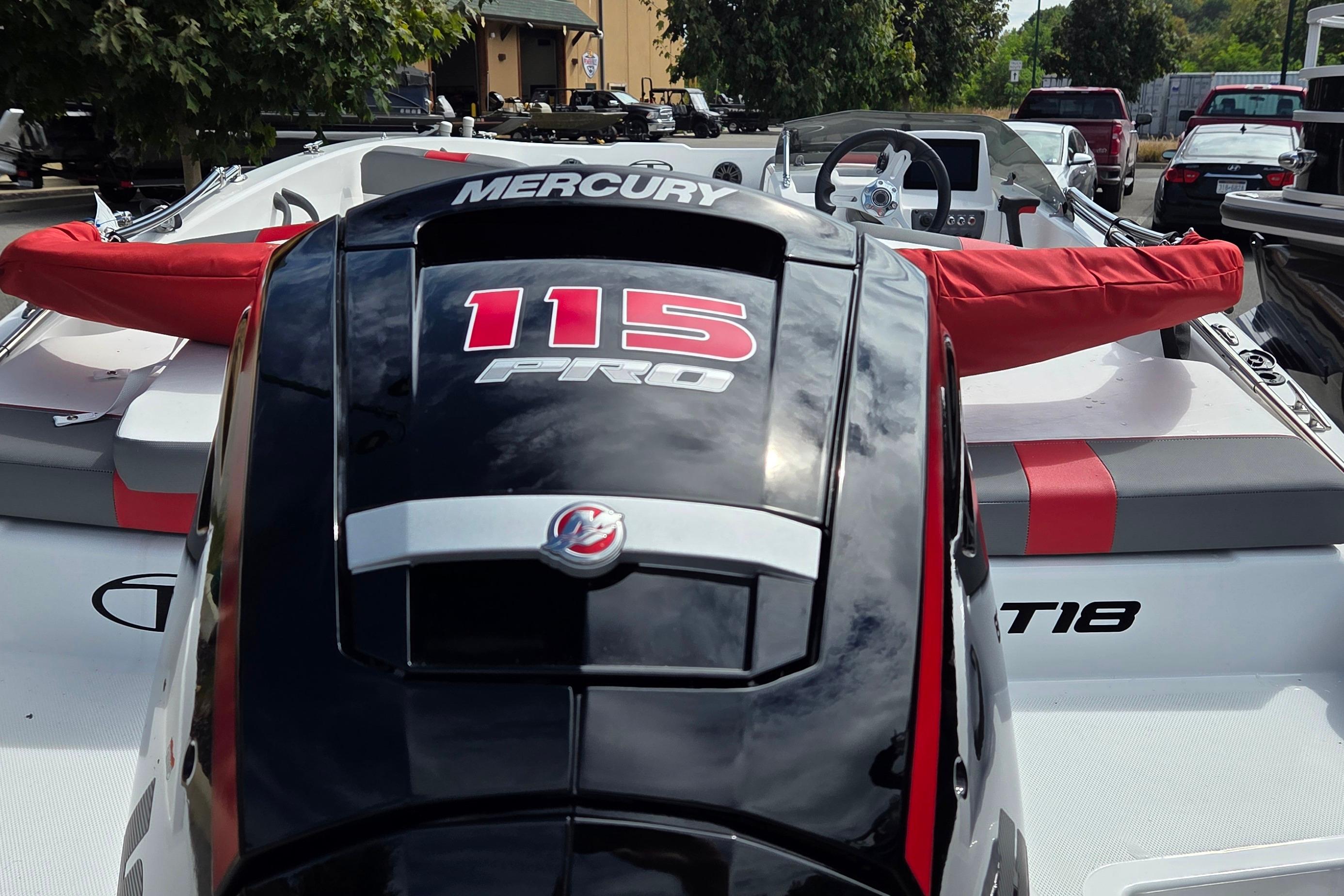 2026 Tahoe T18 boat with Mercury 115 Pro engine, parked outdoors.