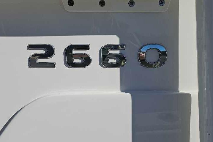 Close-up of 2026 Ranger 2660 Bay model emblem on white surface.