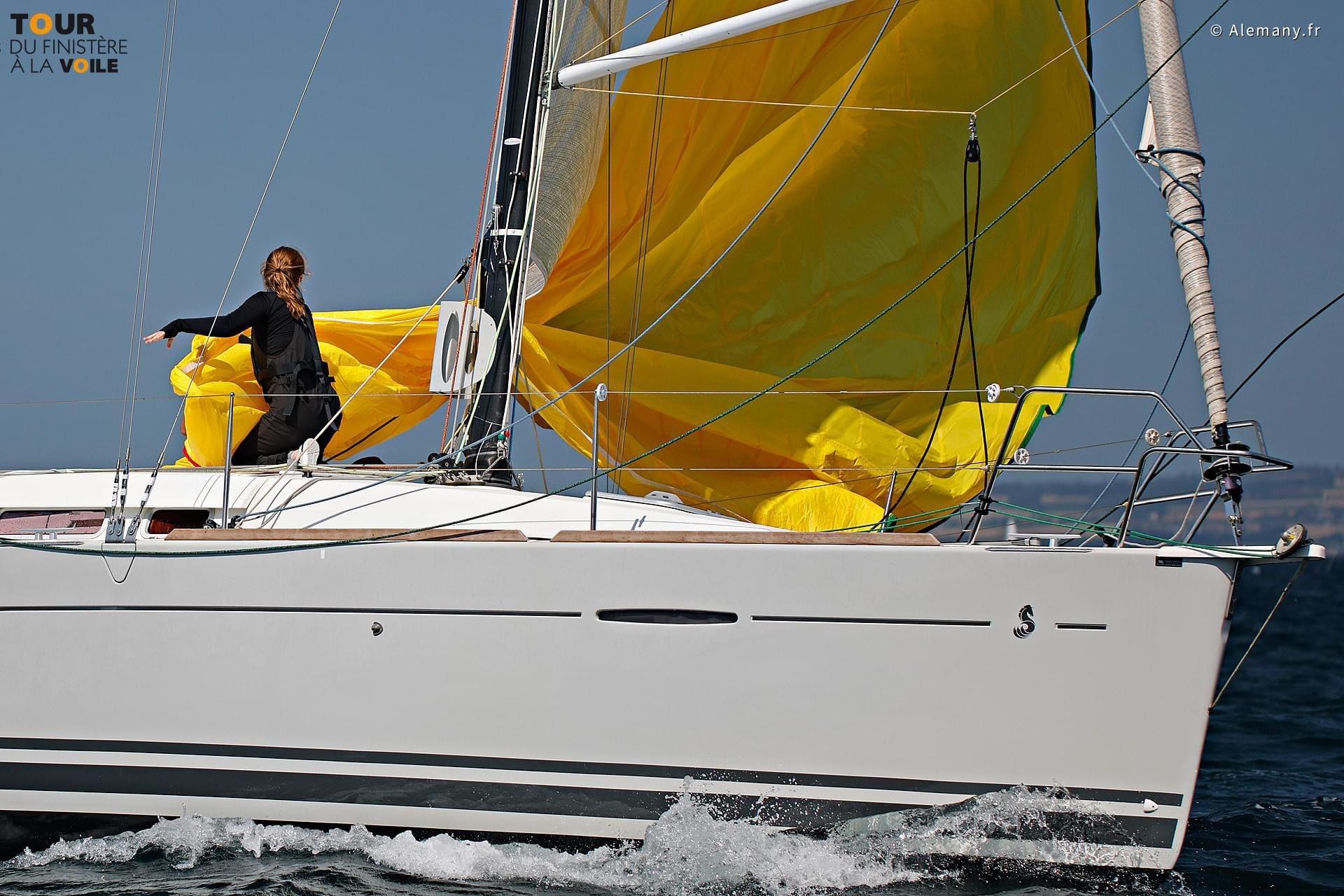 Sailing a 2011 Beneteau First 35 with vibrant yellow sails on open water.