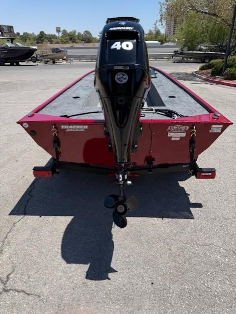 2025 Tracker Panfish 17 boat with Mercury 40 engine, parked outdoors.