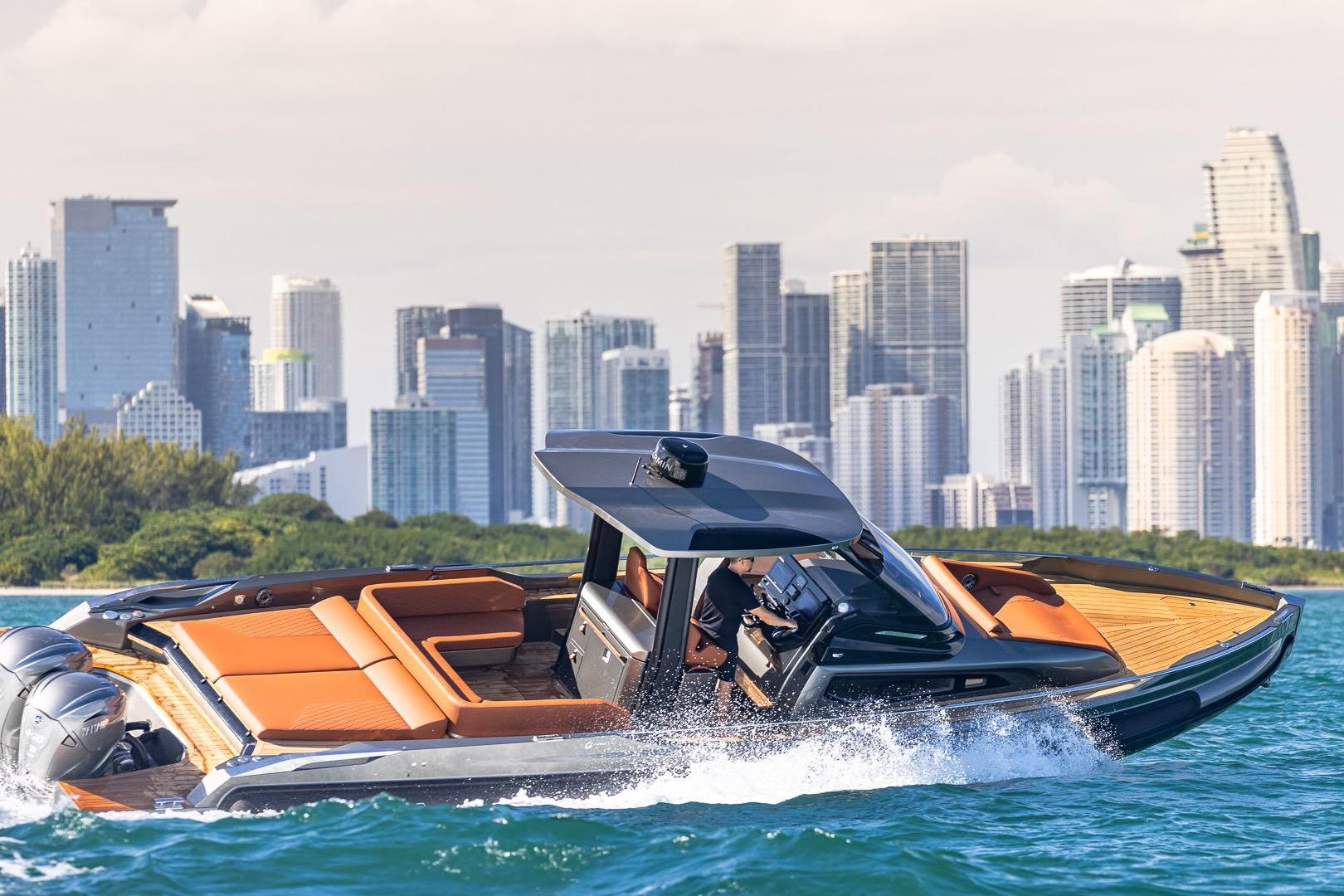 2026 Capeli STRADIVARI 43 luxury boat cruising near city skyline.