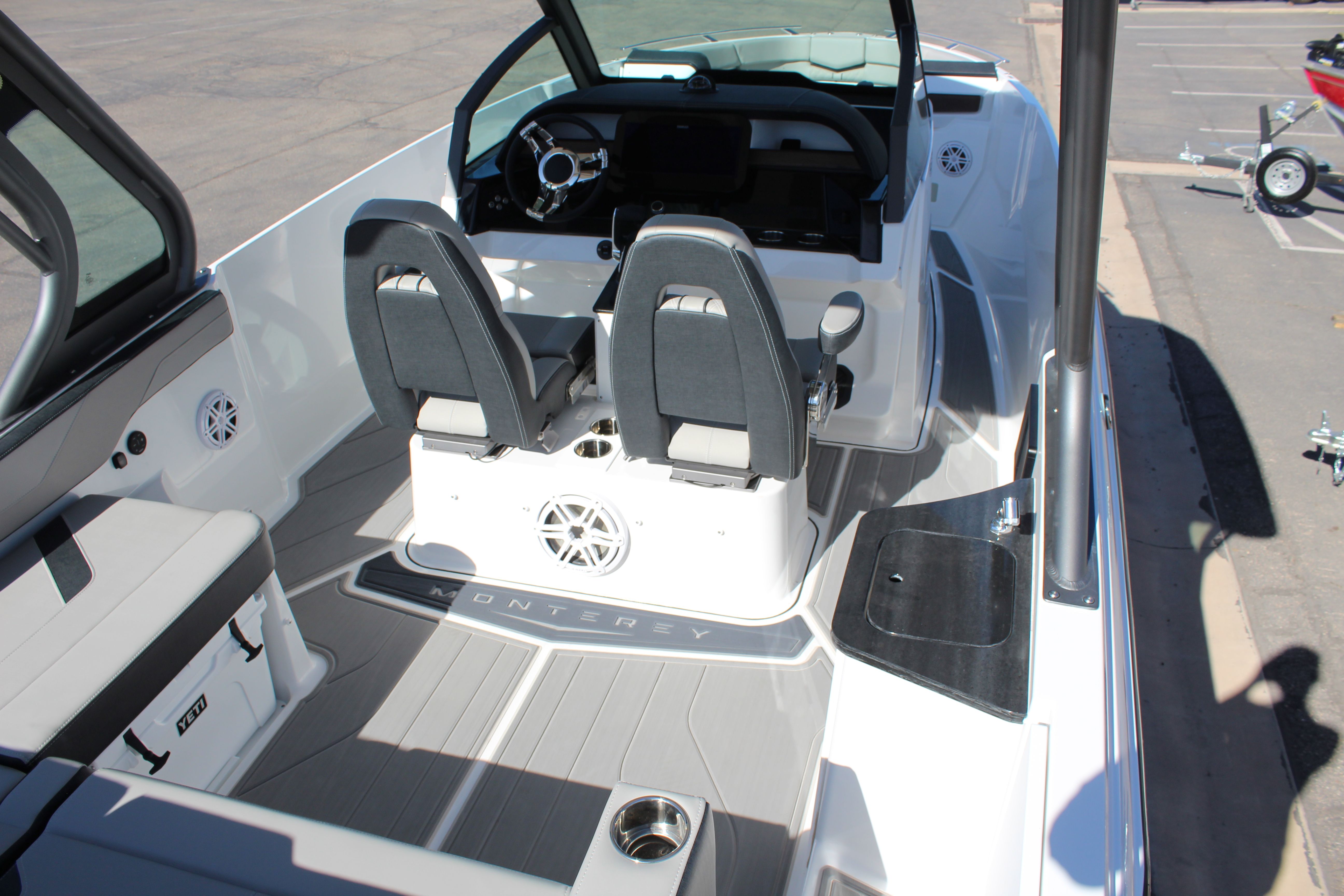 Interior of 2025 Monterey Elite 27 OB boat with modern seating.