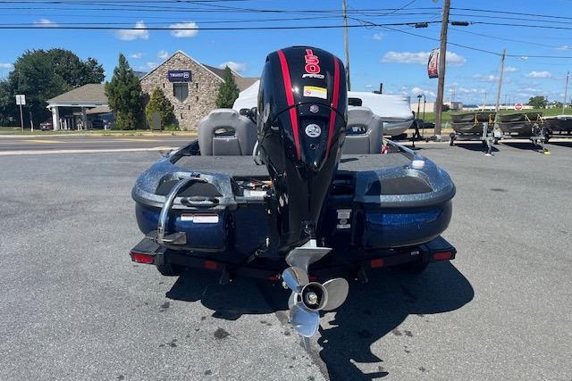 2026 Nitro Z18 Pro boat with powerful outboard motor, parked outdoors on a sunny day.