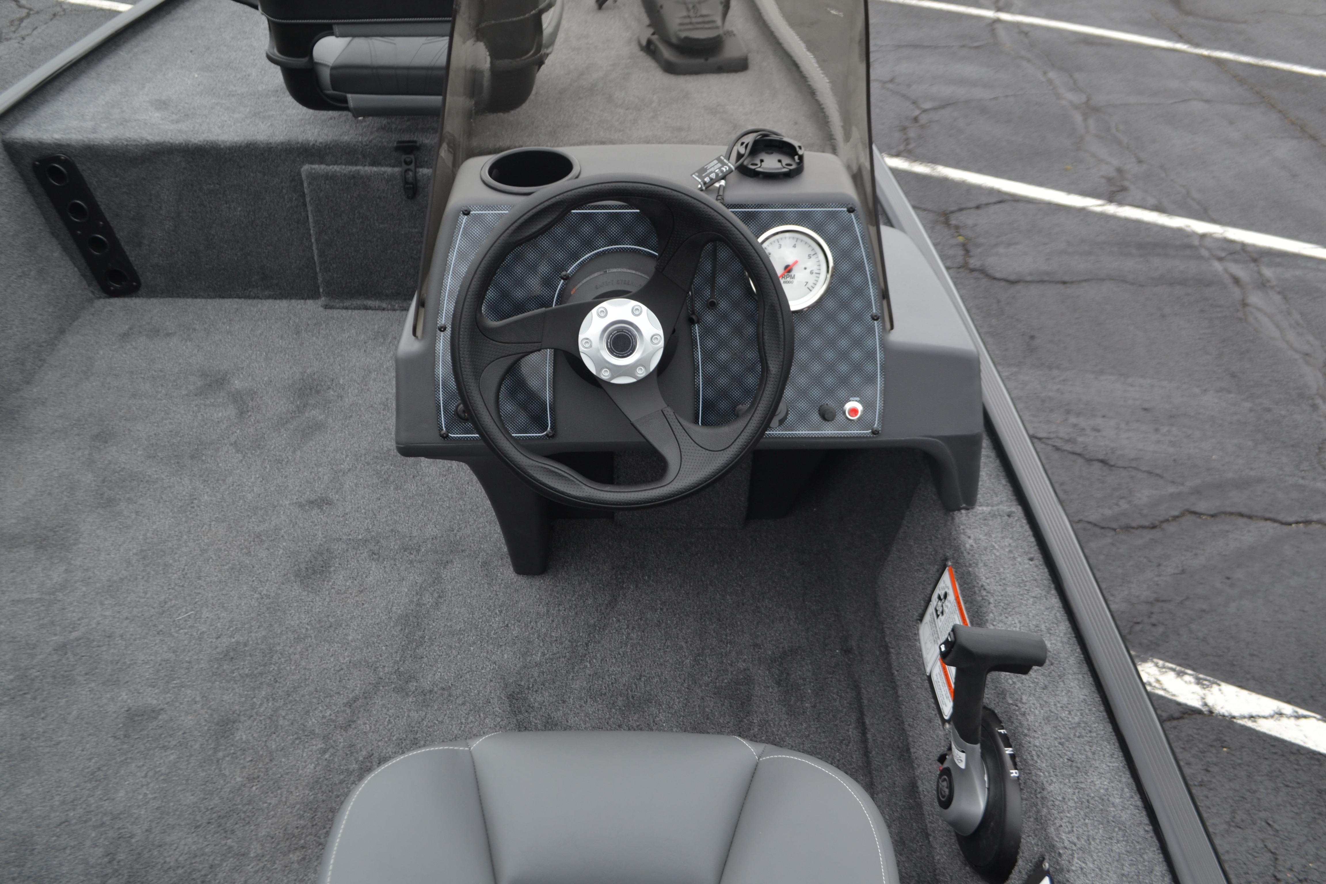 2026 Tracker Bass Tracker Classic XL boat interior with steering wheel and dashboard controls.