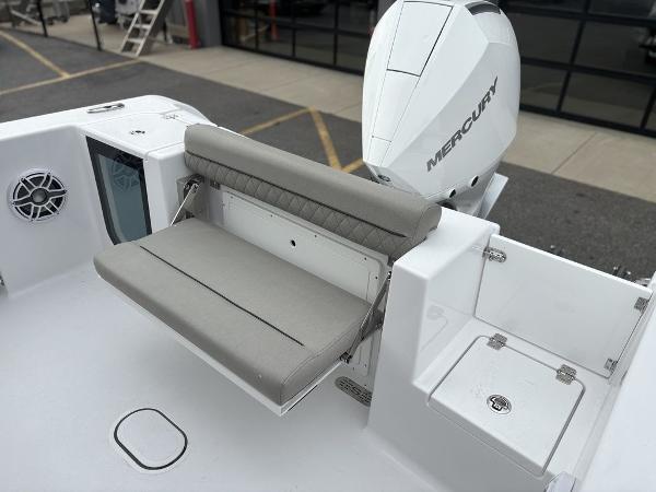2025 Sportsman Open 232 boat with Mercury engine and foldable seating.