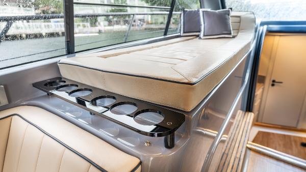 Luxurious interior of 2026 Hanover 415 yacht with seating and cup holders.