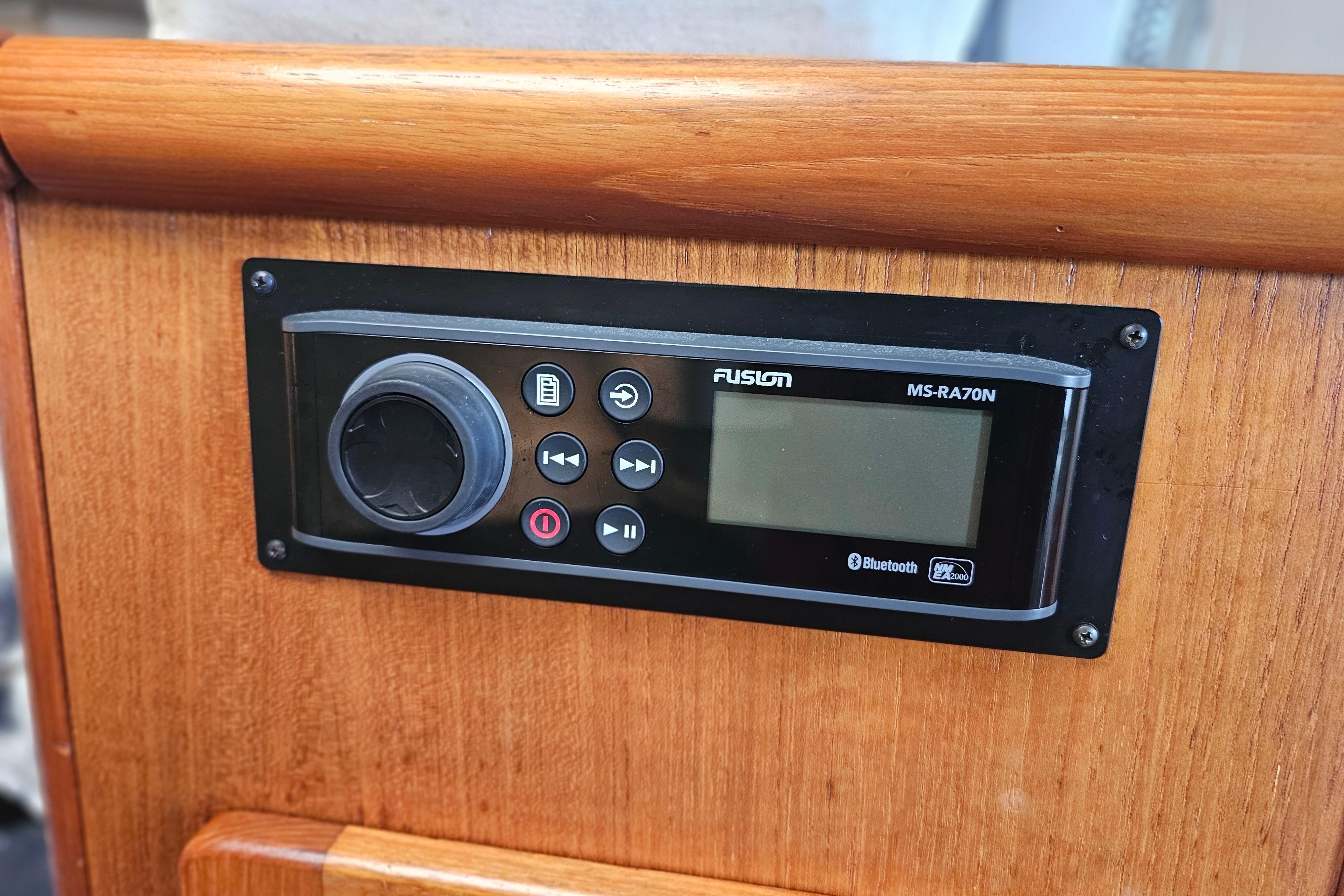 Fusion MS-RA70N stereo system on 2001 Pursuit 3000 Express boat dashboard.