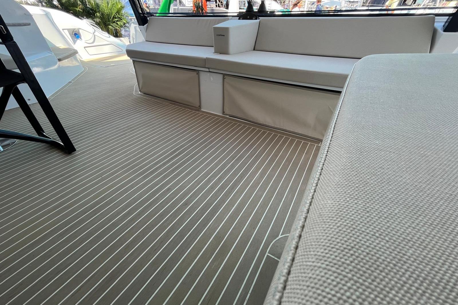 Luxurious interior of 2026 Comar C-CAT 65 yacht with sleek seating and modern design.