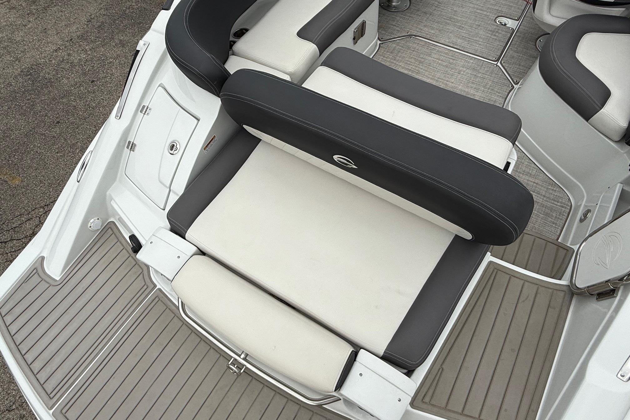 2022 Crownline 255 SS boat interior with cushioned seating and deck flooring.