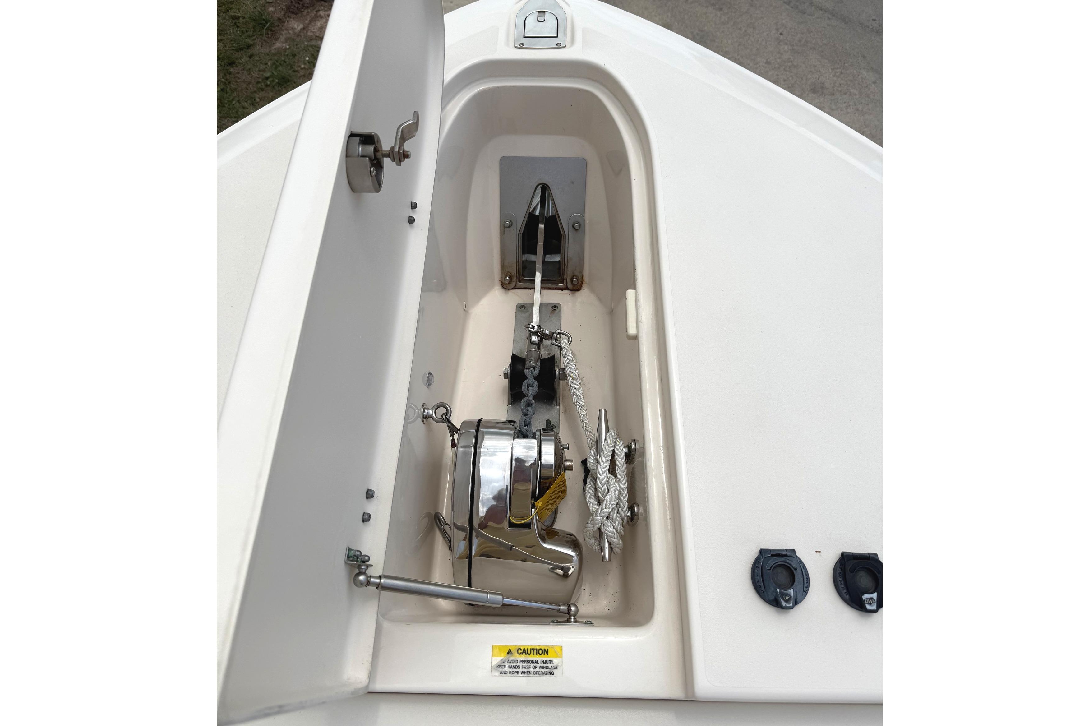 Anchor compartment of 2018 Grady-White Canyon 306 boat, featuring winch and rope storage.