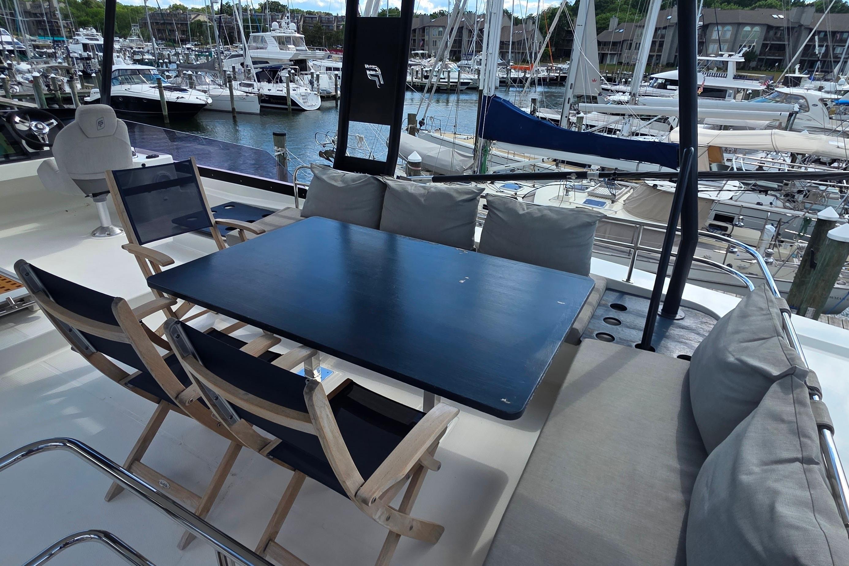 Luxurious 2018 Fountaine Pajot Motor Yacht 44 with elegant outdoor seating area.