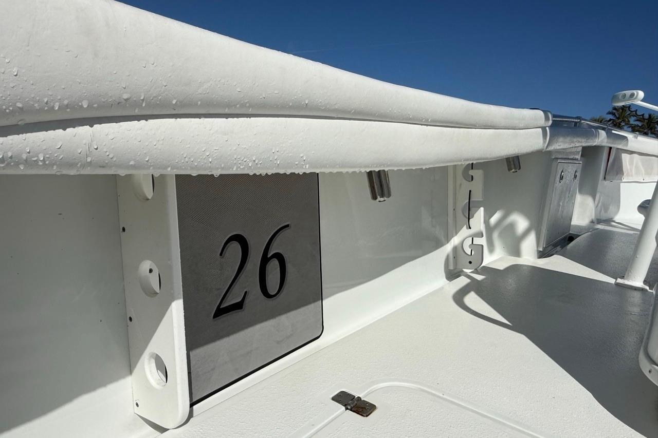 2017 Yellowfin 26 Hybrid boat interior with number 26, featuring sleek white design.