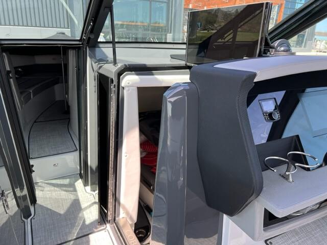 2020 Cobalt A36BR boat interior with helm, seating, and cabin entrance.
