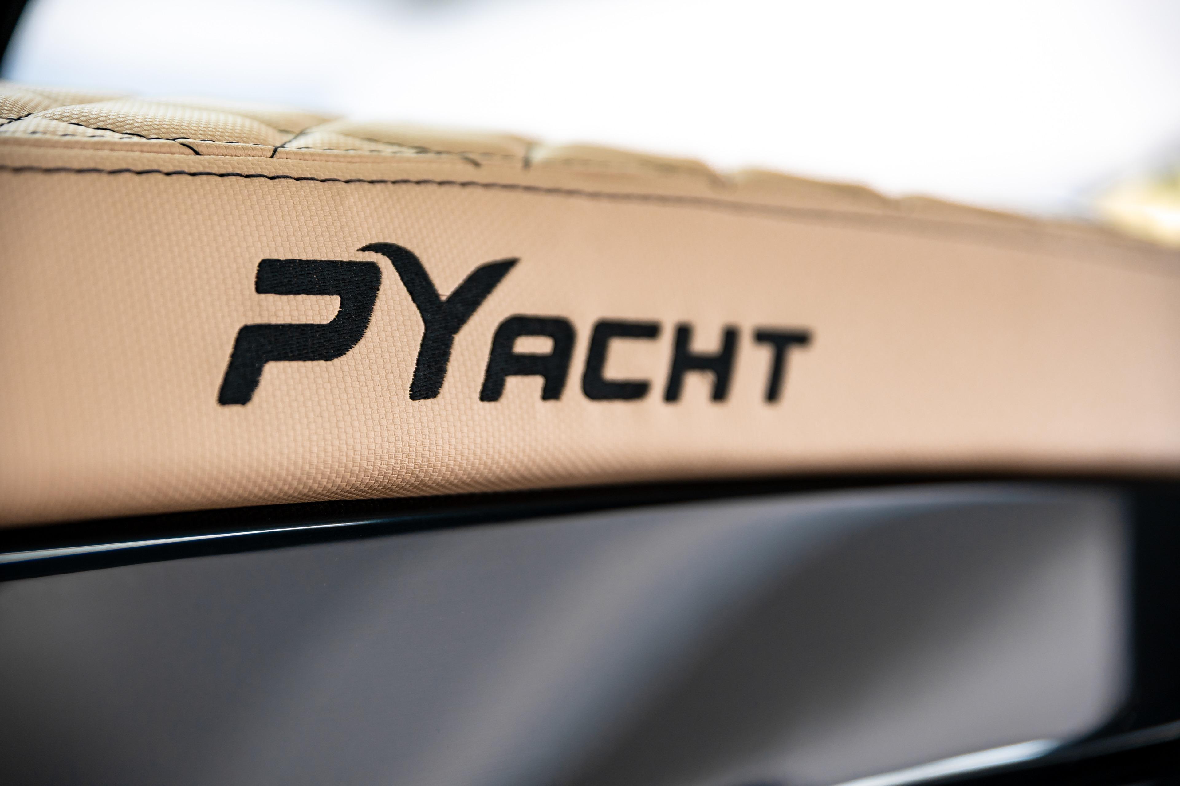 Close-up of PYACHT logo on 2026 PY 100 XL yacht interior.