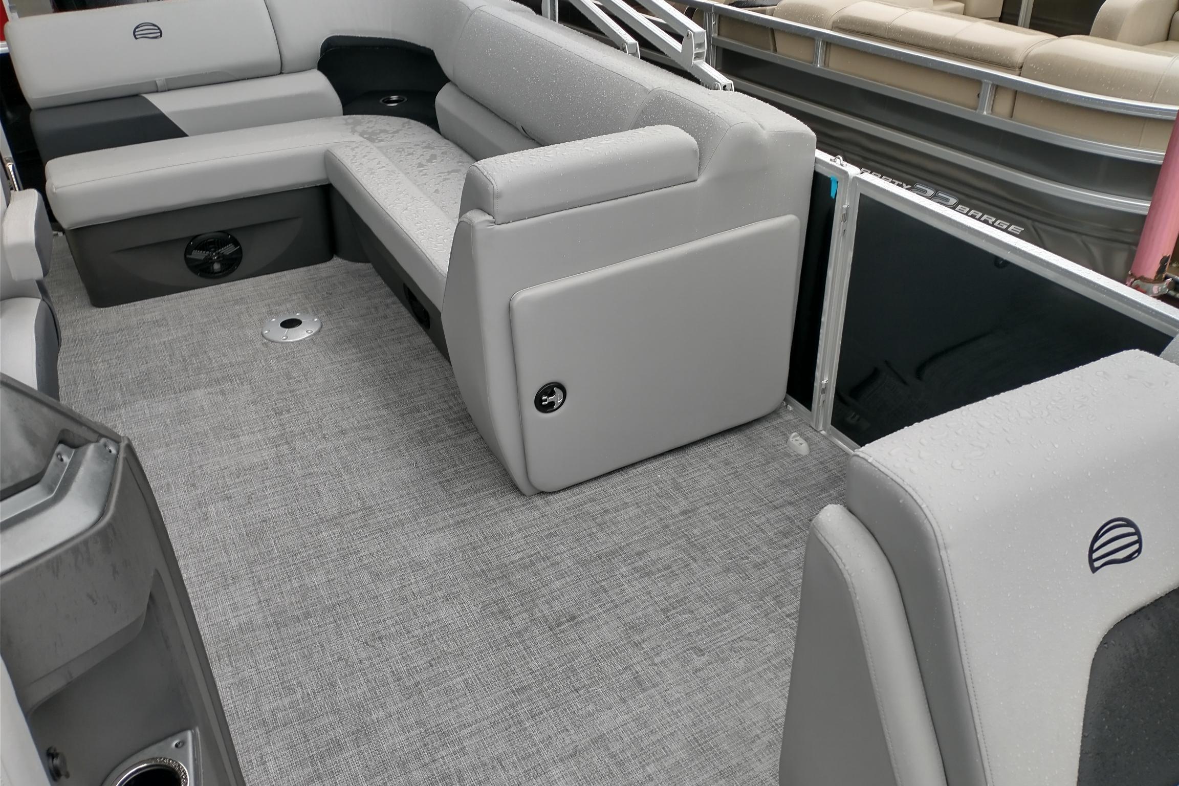 2026 Sun Tracker Party Barge 20 DLX interior with gray seating and flooring.