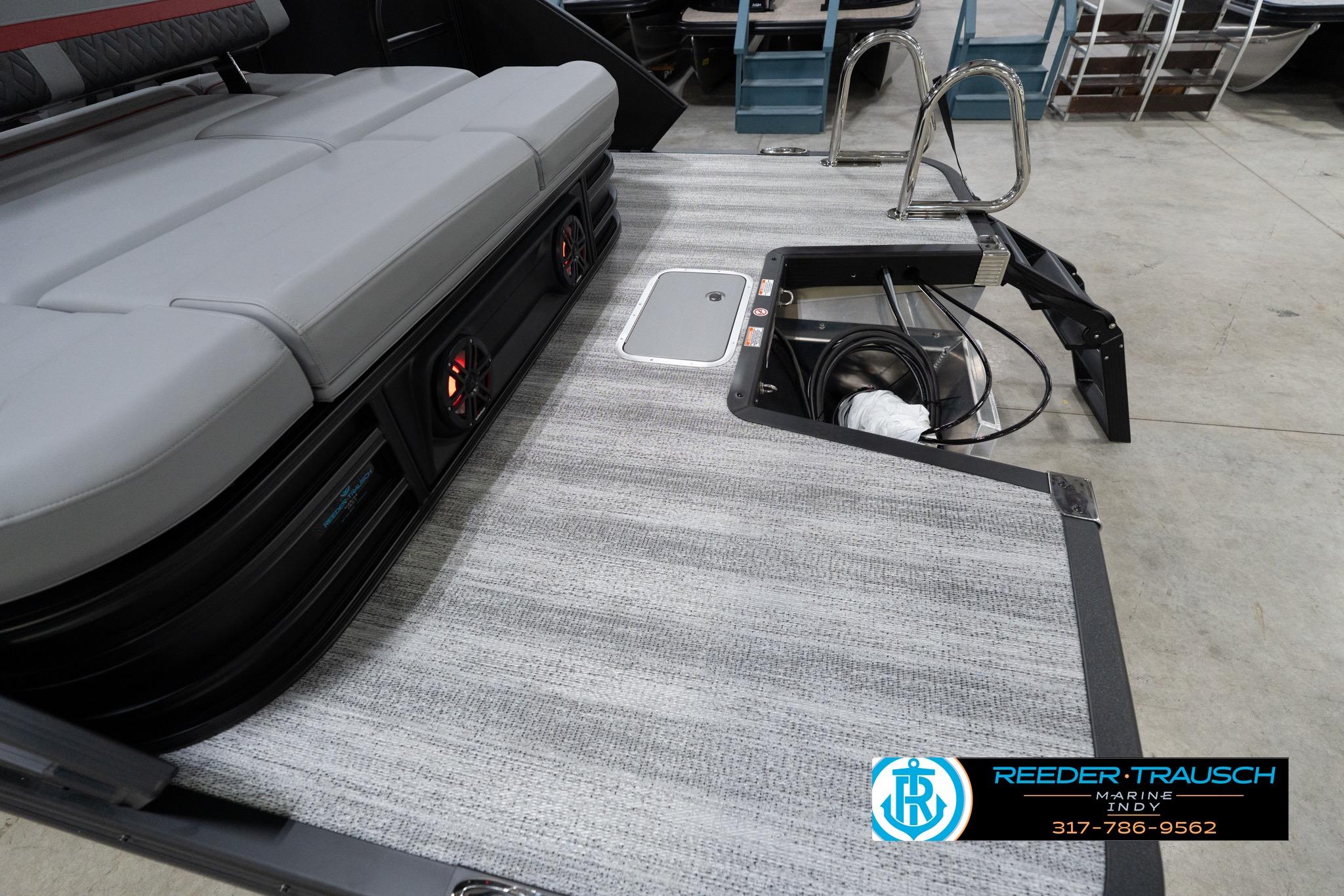 2026 Bennington 22 MSB boat interior with cushioned seating and storage area.