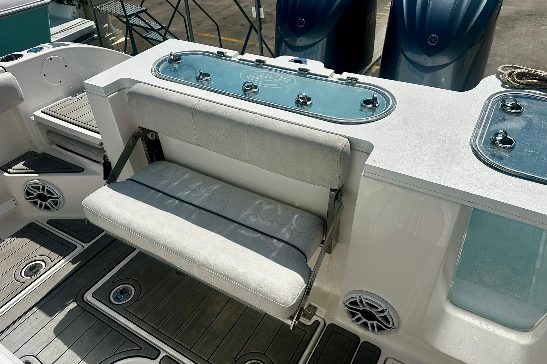 Sea Fox 228 Commander 2002 boat interior with seating and storage compartments.