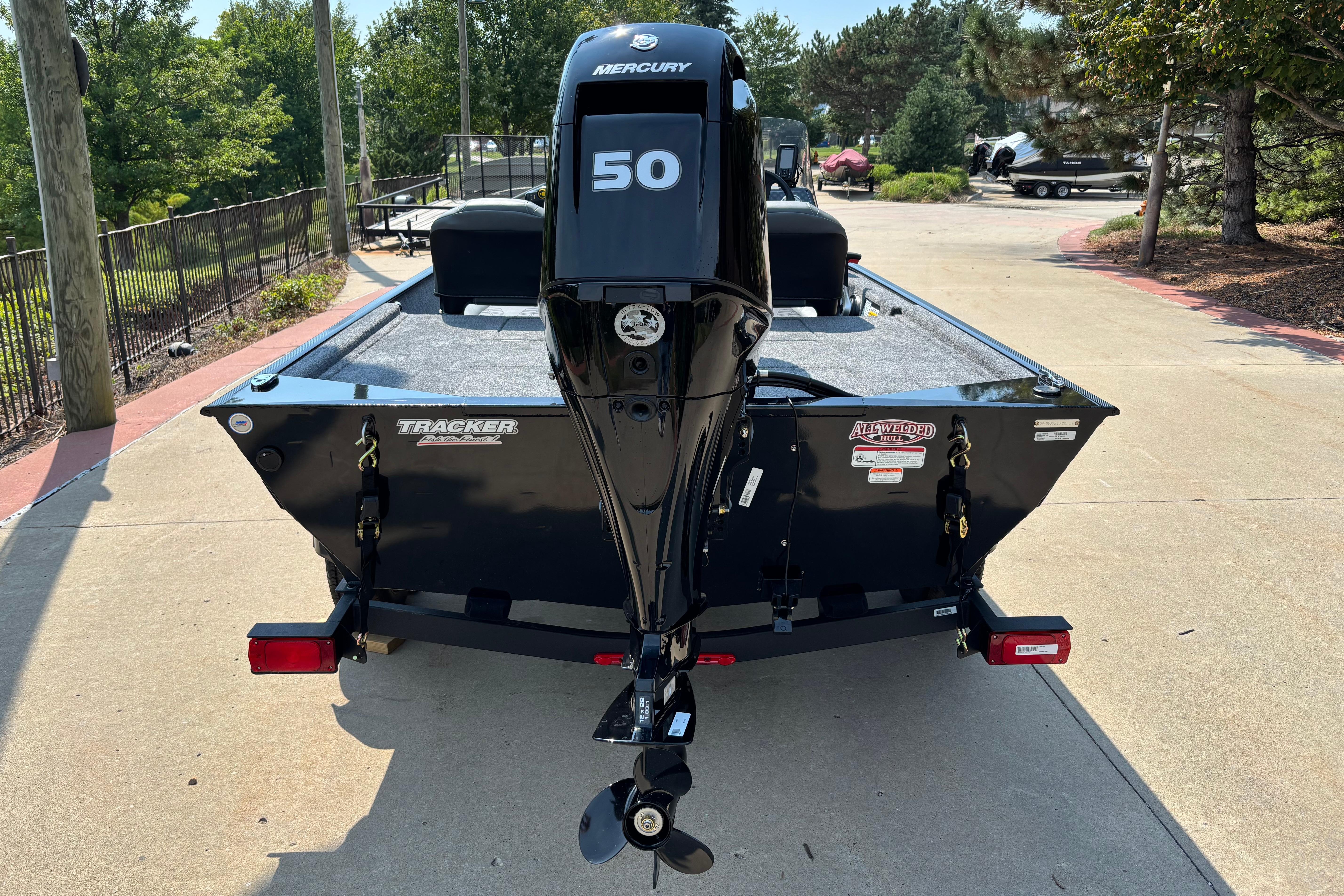 2026 Tracker Bass Tracker Classic XL boat with Mercury 50 engine, parked outdoors.