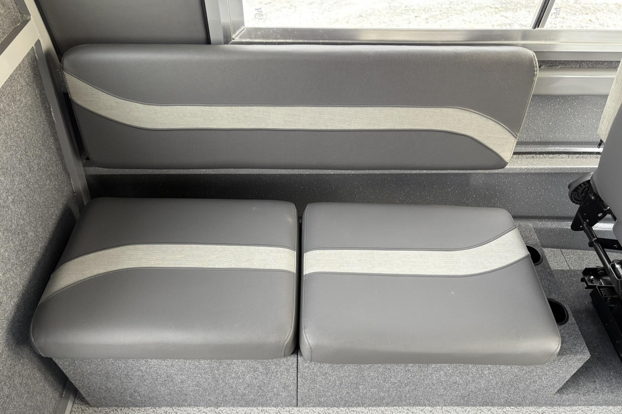 2024 Spartan 26 Maximus Pro XL interior seating with gray upholstery and modern design.