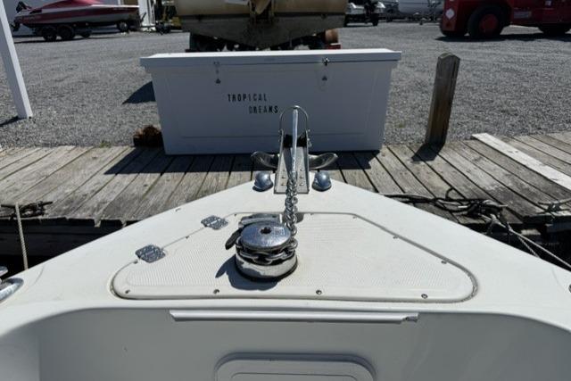 Bow of 2006 Sailfish 2660 CC boat at dock with anchor chain.