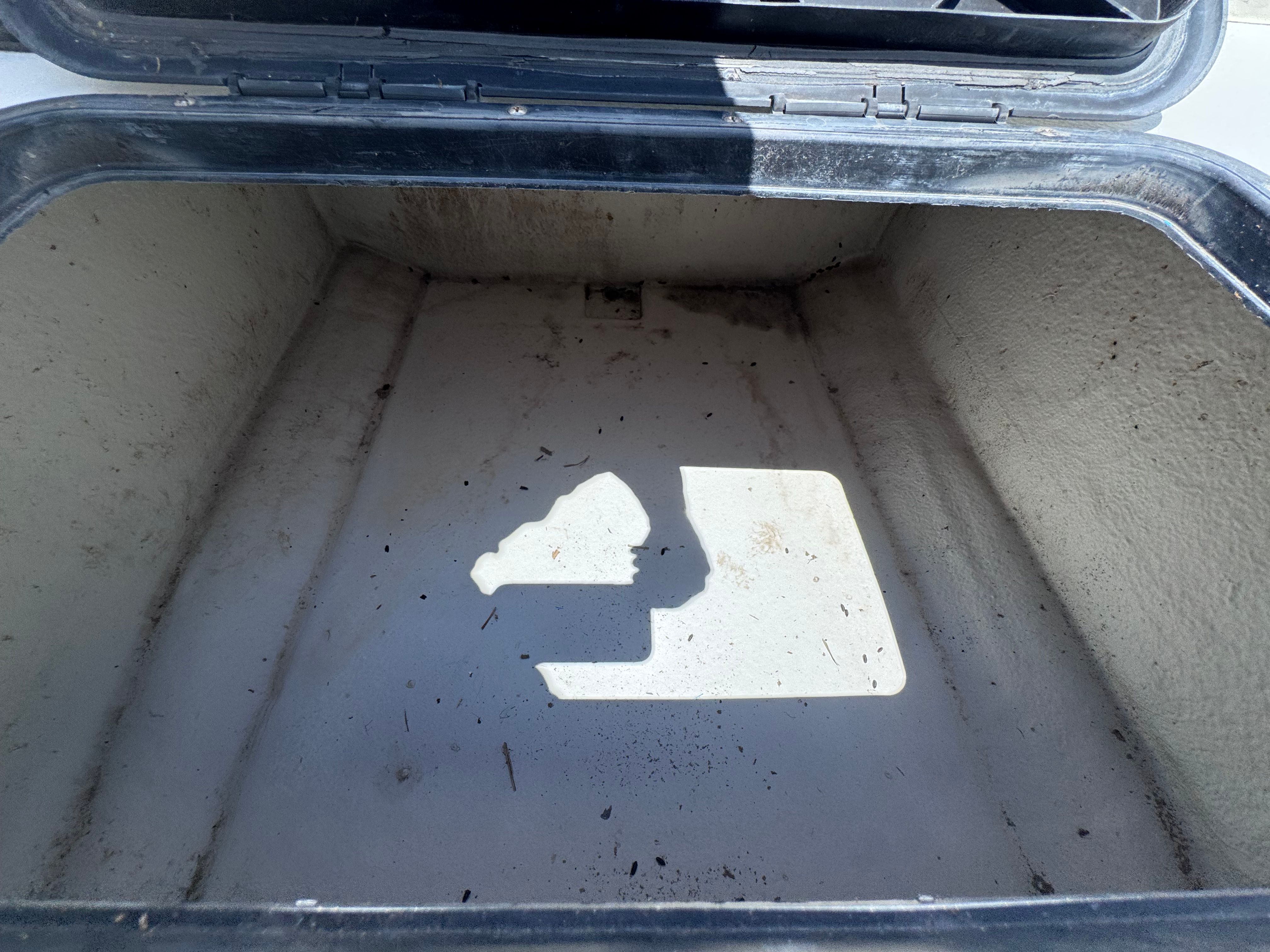 Empty storage compartment on a 1998 Dusky 20.3 boat.