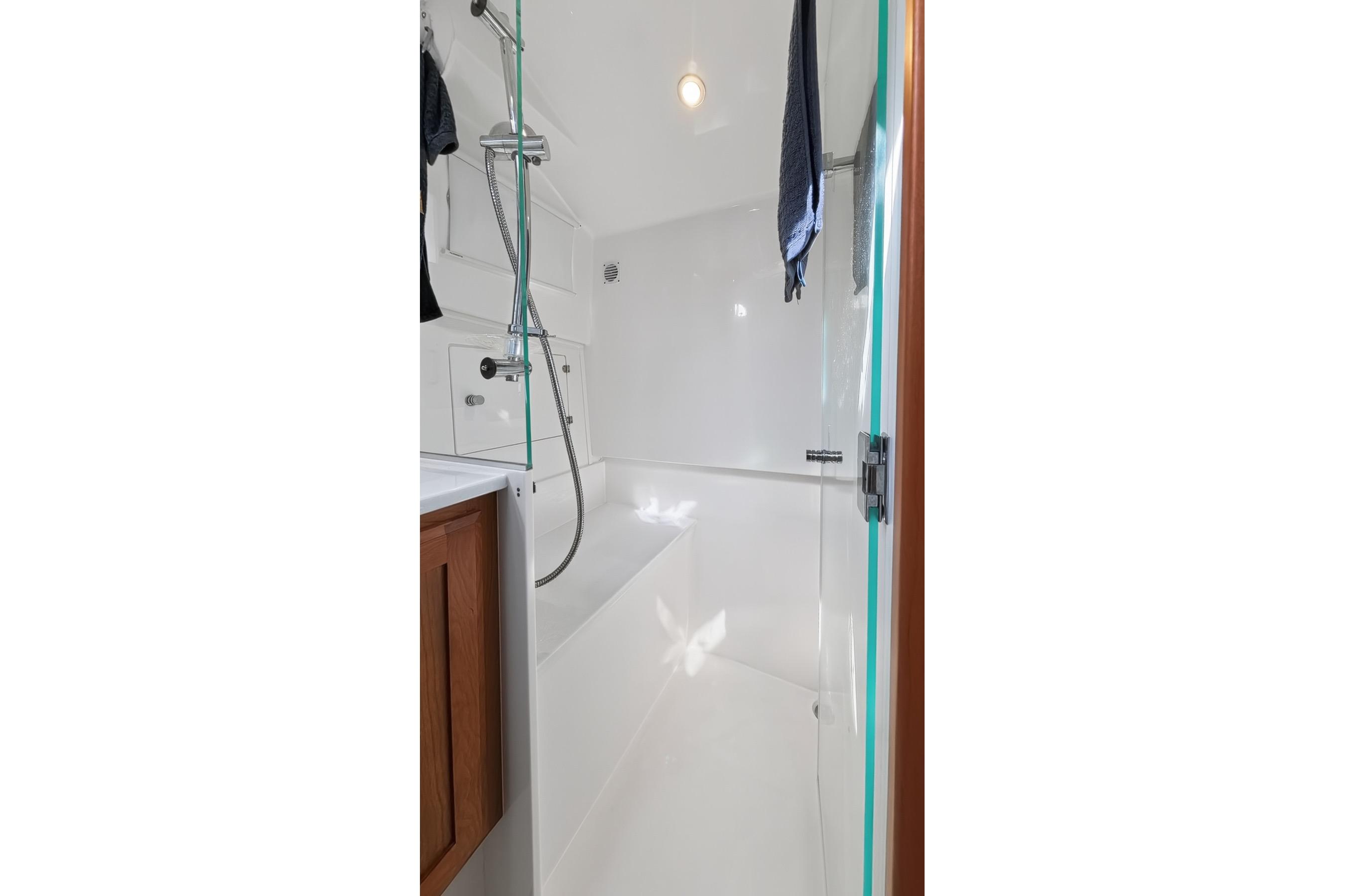 2024 Back Cove 39O yacht bathroom with modern shower and sleek design.