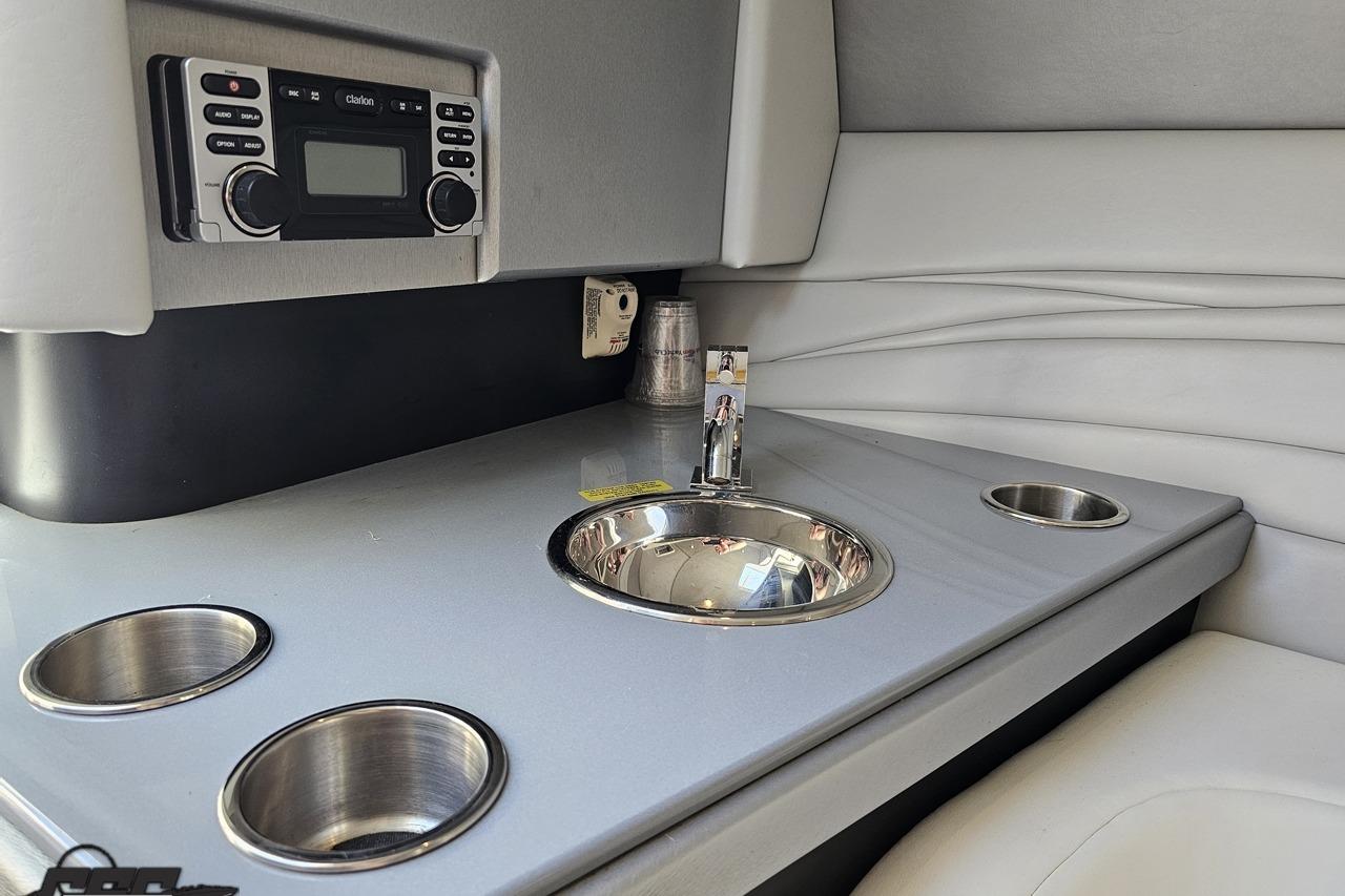 2014 Formula 292 FASTech cabin interior with sink and stereo system.