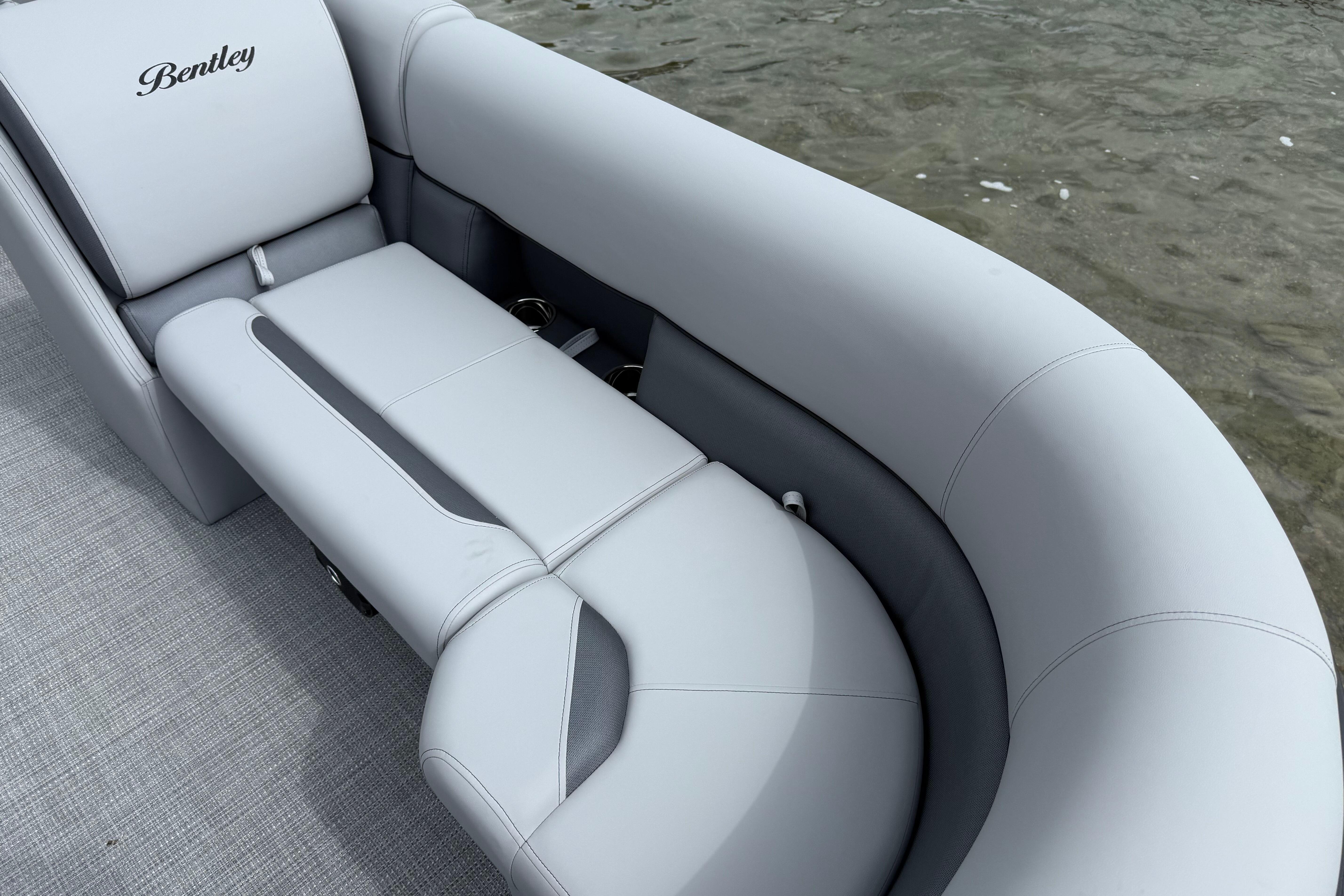 2026 Bentley Pontoons Legacy 220 Navigator with luxurious seating on water.