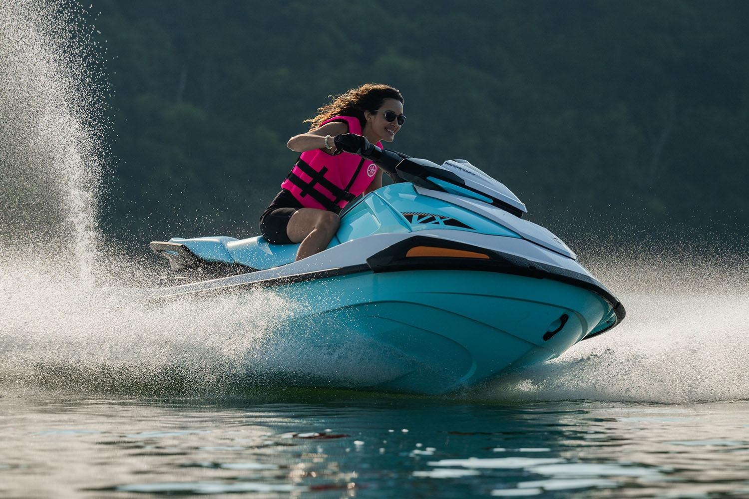 Manufacturer Provided Image: 2026 Yamaha WaveRunner VX jet ski speeding on water, rider wearing pink life vest.