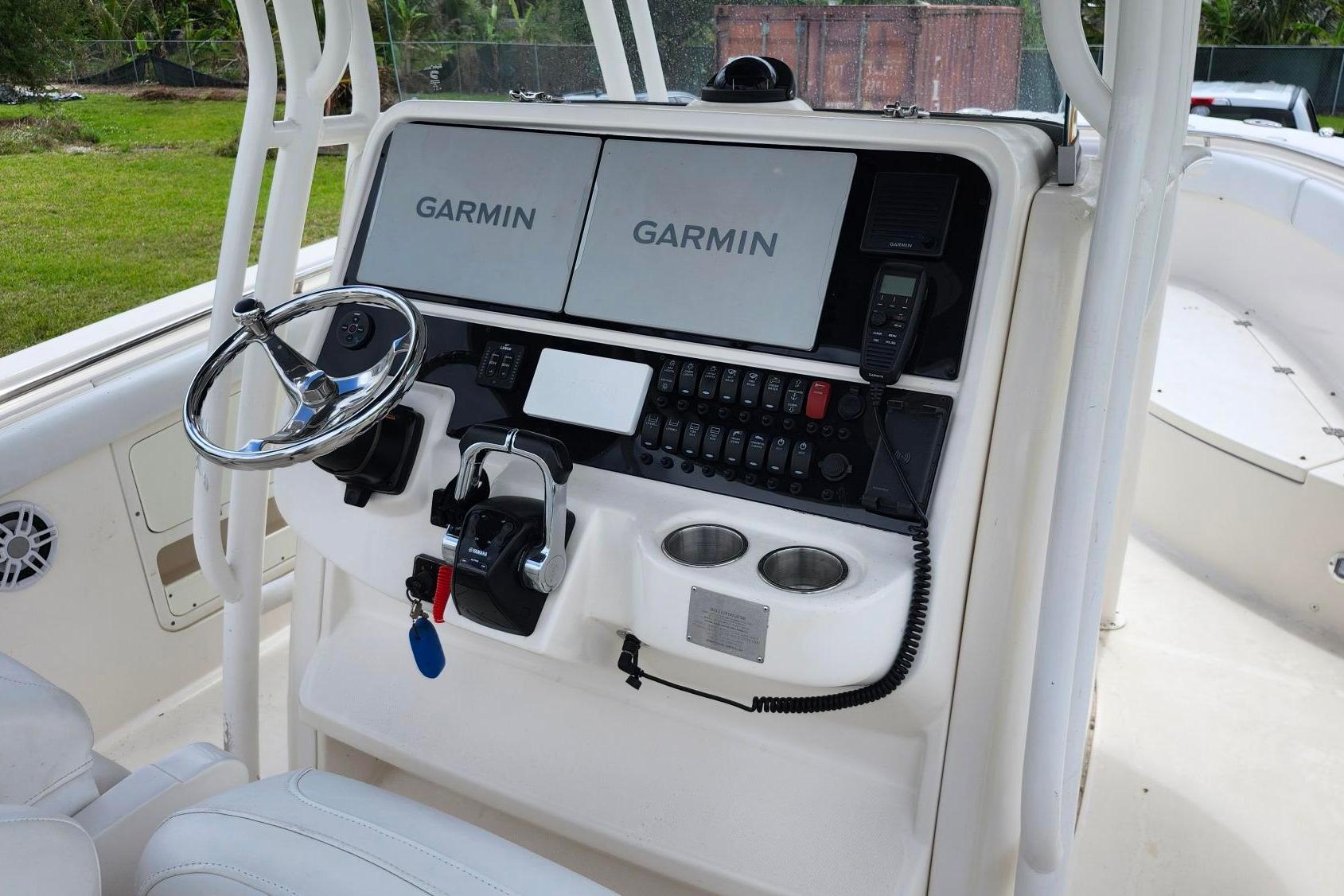 2015 Robalo R300 Center Console helm with Garmin navigation displays.