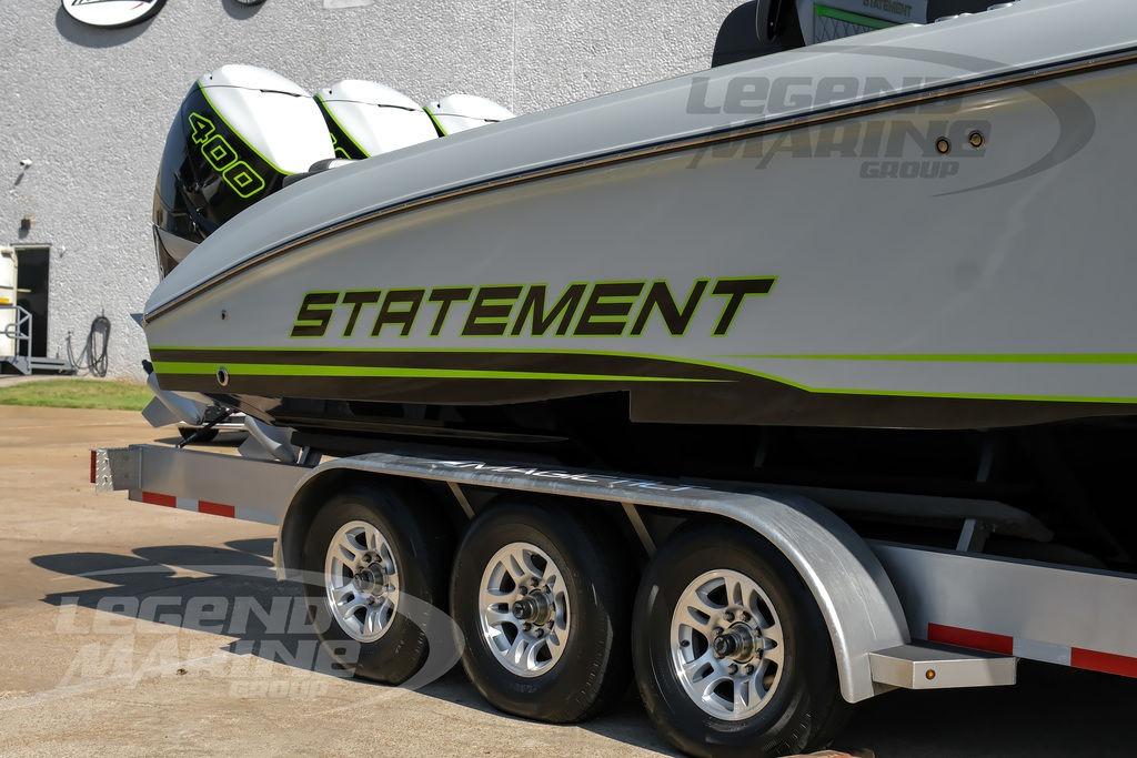 2024 Statement 350 Open boat on trailer, featuring bold green accents and twin engines.