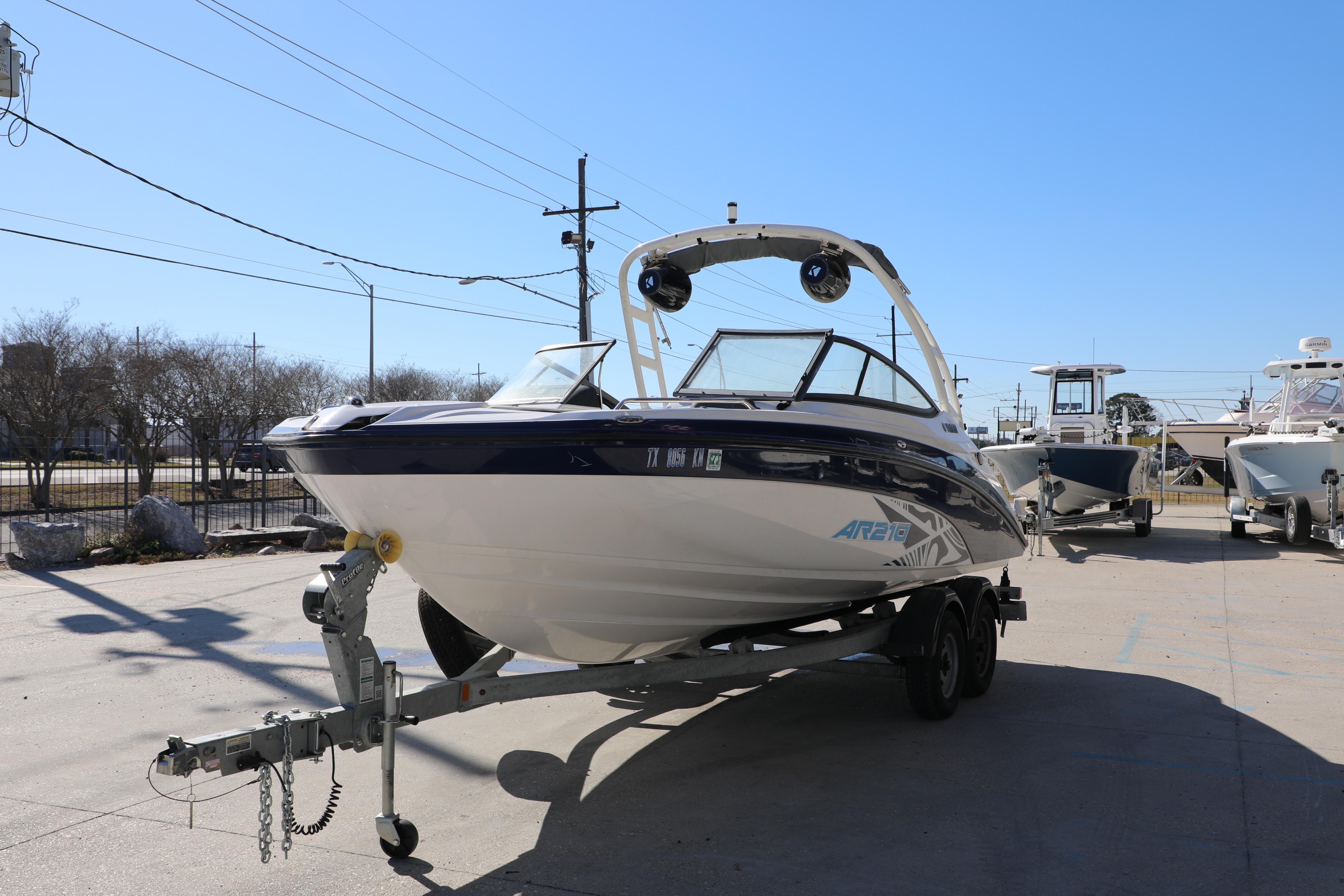 2022 Yamaha Boats AR210 on trailer in sunny outdoor setting.