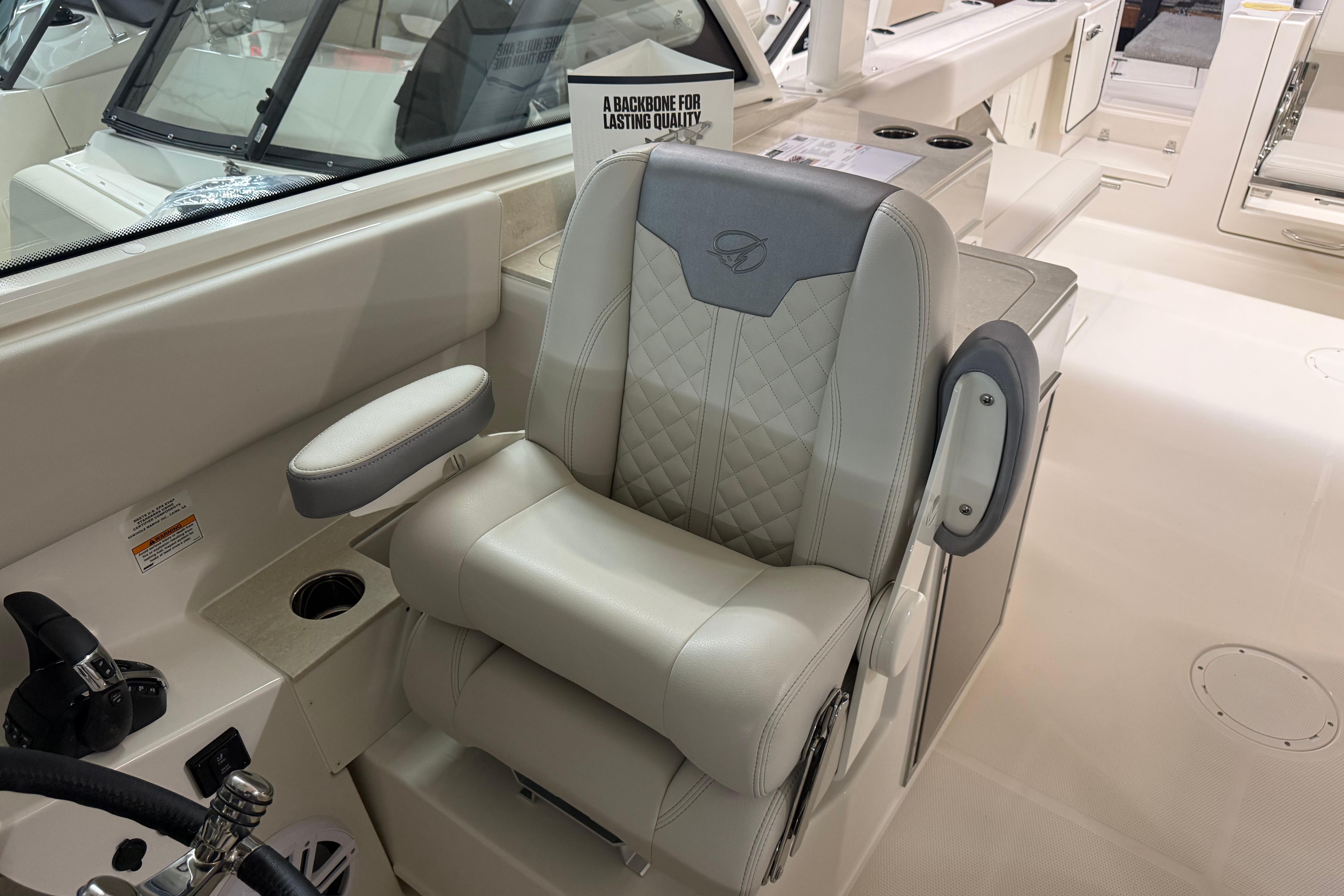 2026 Sailfish 316 DC boat interior with luxurious captain's chair and modern design.