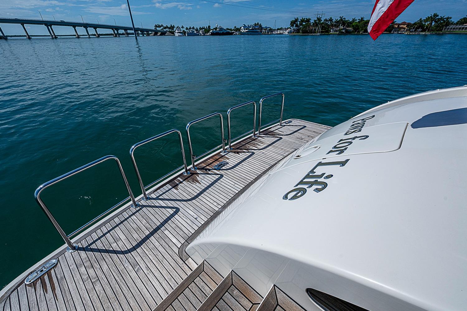 Luxury yacht Marlow 80 Explorer 2014 on serene water with bridge view.