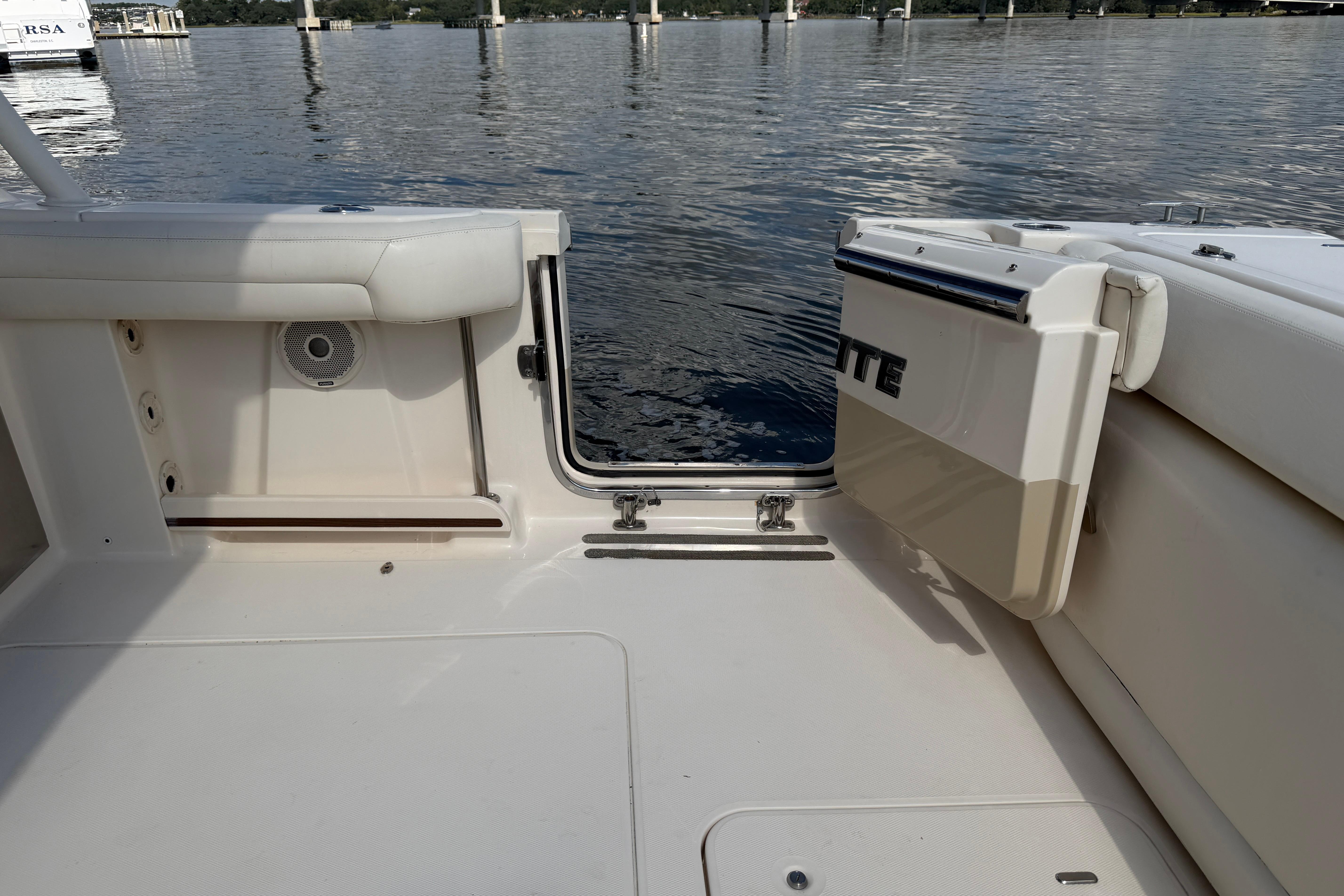 2017 Grady-White Freedom 335 boat interior with open transom door on calm water.