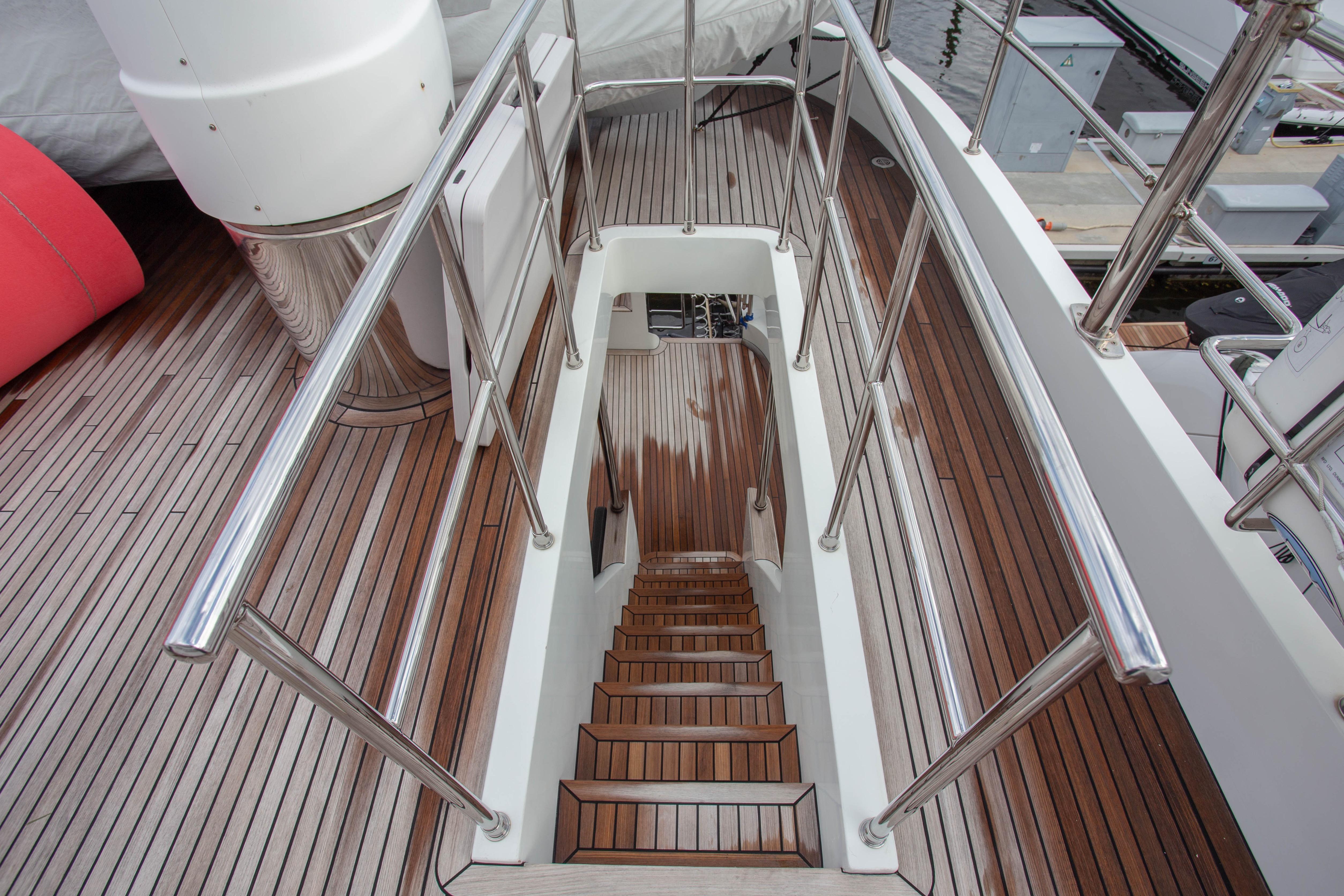Staircase on 2014 Fifth Ocean Yachts 24m Displacement Explorer Yacht with wooden deck.