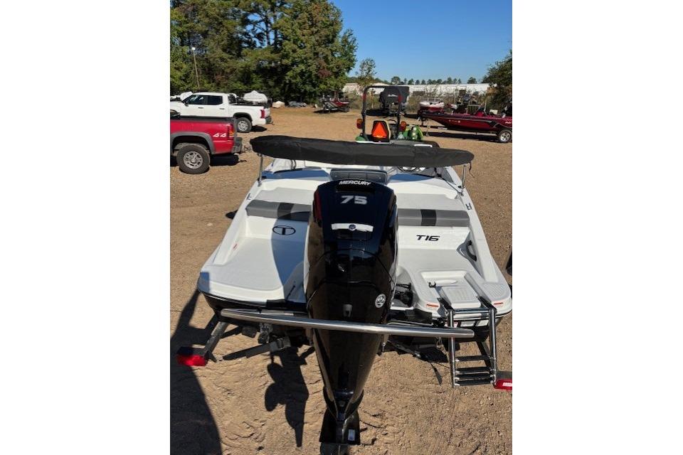 2026 Tahoe T16 boat with Mercury 75 engine, parked outdoors.