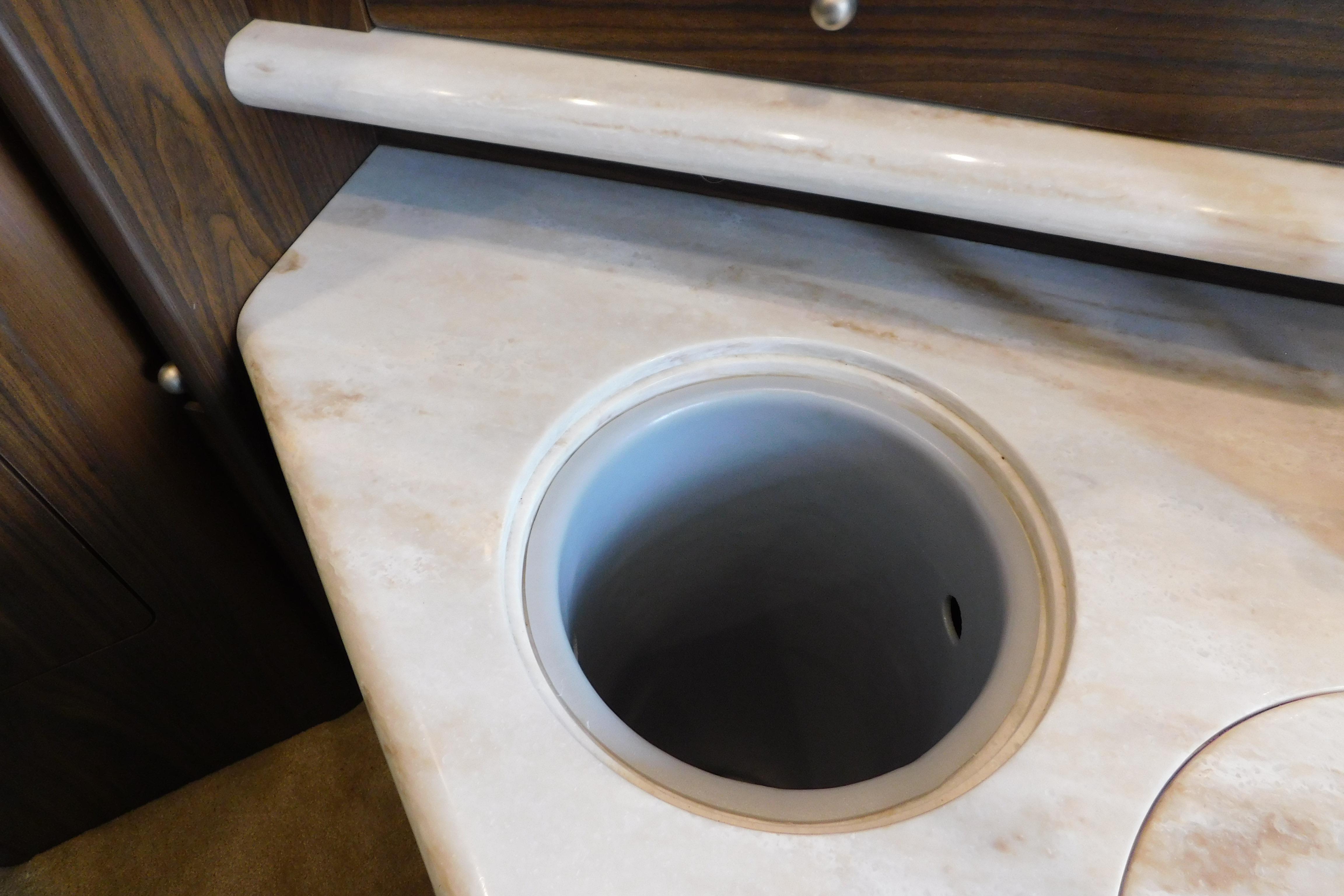 Marble countertop with built-in sink on 2017 Rinker EX 320 boat.