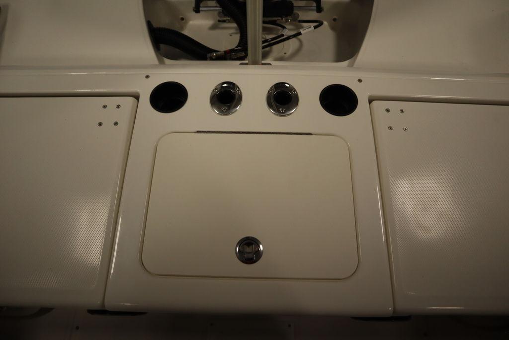 2026 Bayliner Trophy T20CC boat dashboard with control panel and storage compartments.